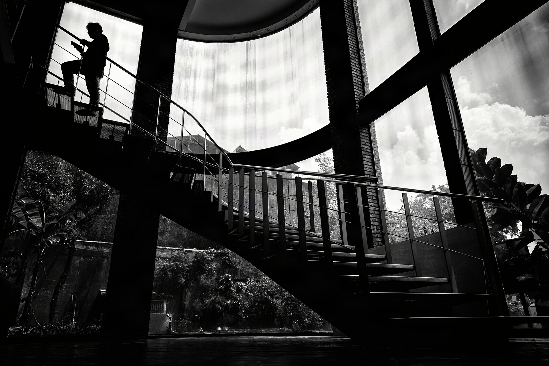 Window lattice breathes; silhouette ascends through space.