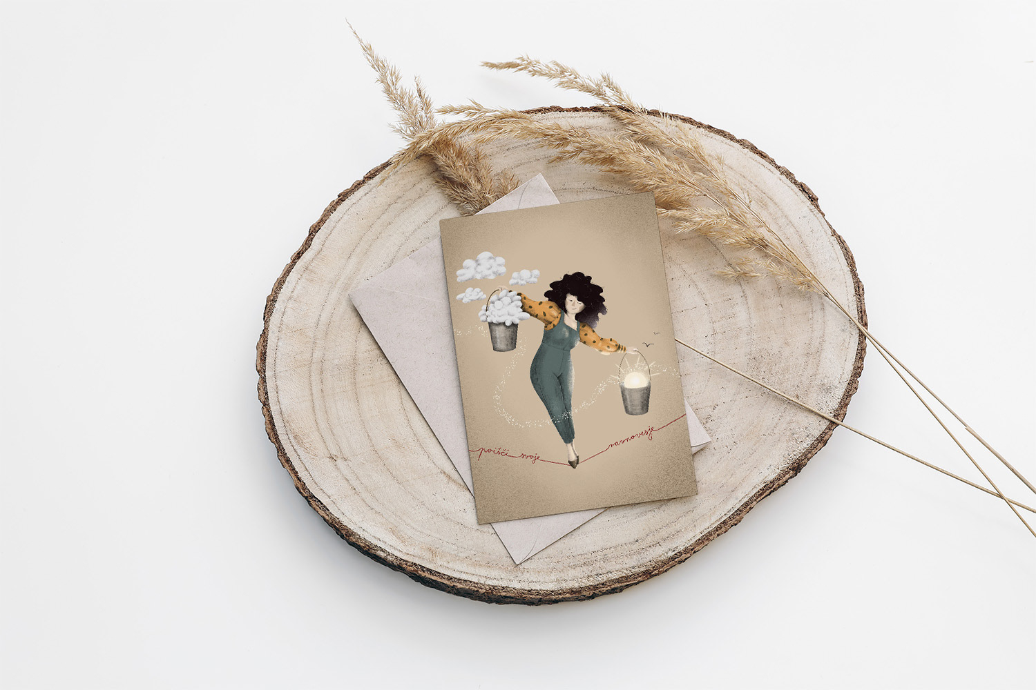 Illustrated greeting card featuring the 'Find Your Balance' illustration by Darka White Art, displayed on a rustic wooden tray with a neutral-toned envelope. The whimsical design depicts a woman balancing buckets of clouds and sun, ideal for personalized art prints and stationery. Perfect for thoughtful gift ideas, custom card designs, and creative home decor styling.