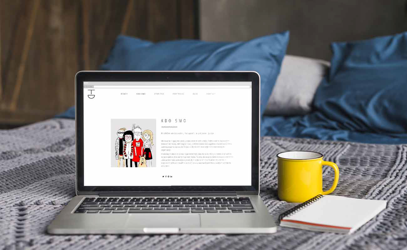 TADA website designed by graphic designer Darka White, displayed on a laptop, featuring humorous and friendly staff illustrations, showcasing the agency's diverse services and creative abilities in photography and design.