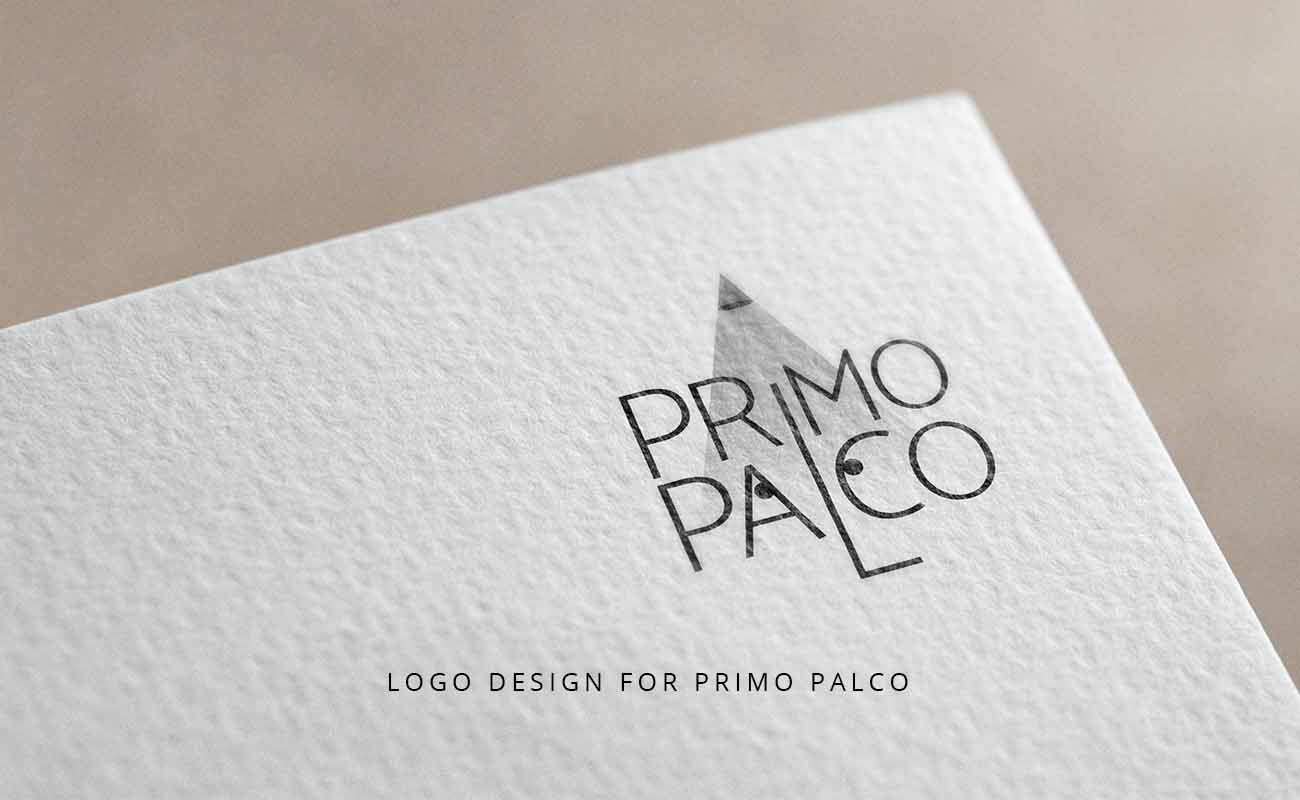 Primo Palco logo designed by graphic designer Darka White, printed on paper, featuring a spotlight as the dot on the 'I' and eyes within the 'a' and 'c' of 'palco' to symbolize stage visibility for young talents.