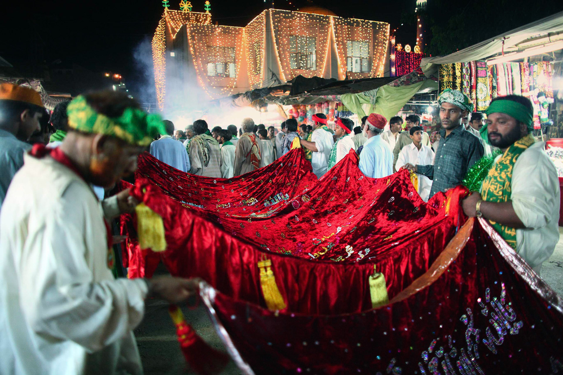 Devotees made their way to the shrine to commune with the saint, offer their tributes and make a wish. On the final day of Urs of Hazrat Lal Shahbaz Qalandar, thousands of pilgrims and devotees were going to present a long red chadar (a cloth used to cover a tomb) with Quranic verse in silver or gold threads. (Travel)