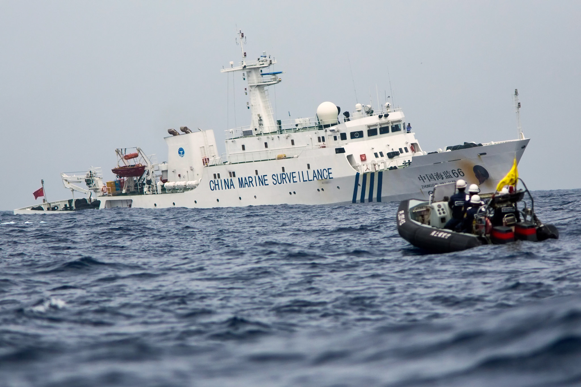 ENKAKU ISLANDS, Japan – A patrol boat from the Japanese Coast Guard escort a Japanese commercial fishing boat after a Chinese government ships appeared into Japanese territorial waters. Chinese government ships were 46 times intrusion into territorial waters. (Photo by Osakabe Yasuo)