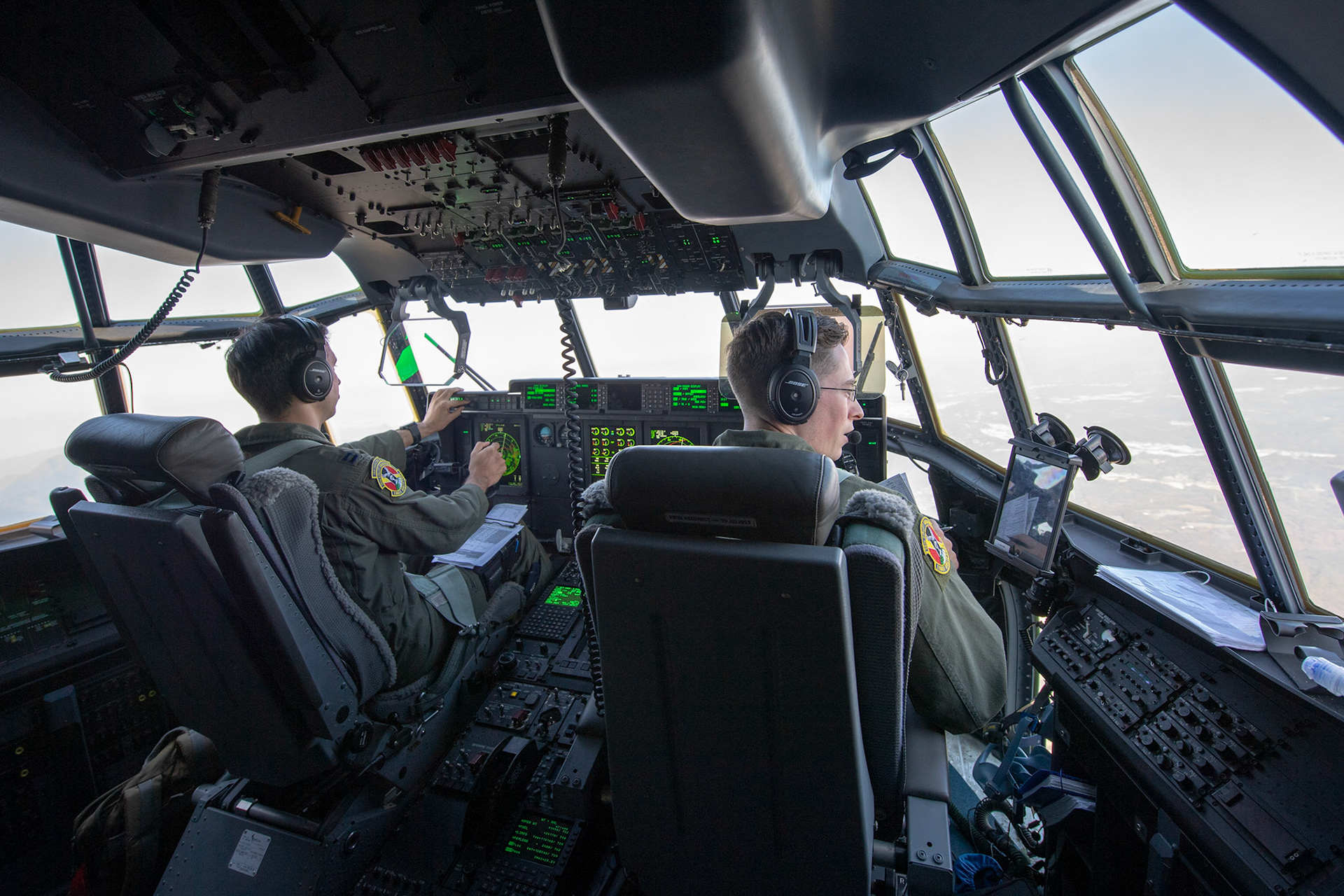 Crewmembers with the 36th Airlift Squadron fly over Kyushu, Japan, Nov. 4, 2018, during Keen Sword 19. U.S. Air Force C-130J Super Hercules’ with the 36 AS became the first U.S. aircraft to drop Japan Ground Self-Defense Force soldiers on Hiju-dai drop zone, Oita prefecture, Japan. (U.S. Air Force photo by Yasuo Osakabe)