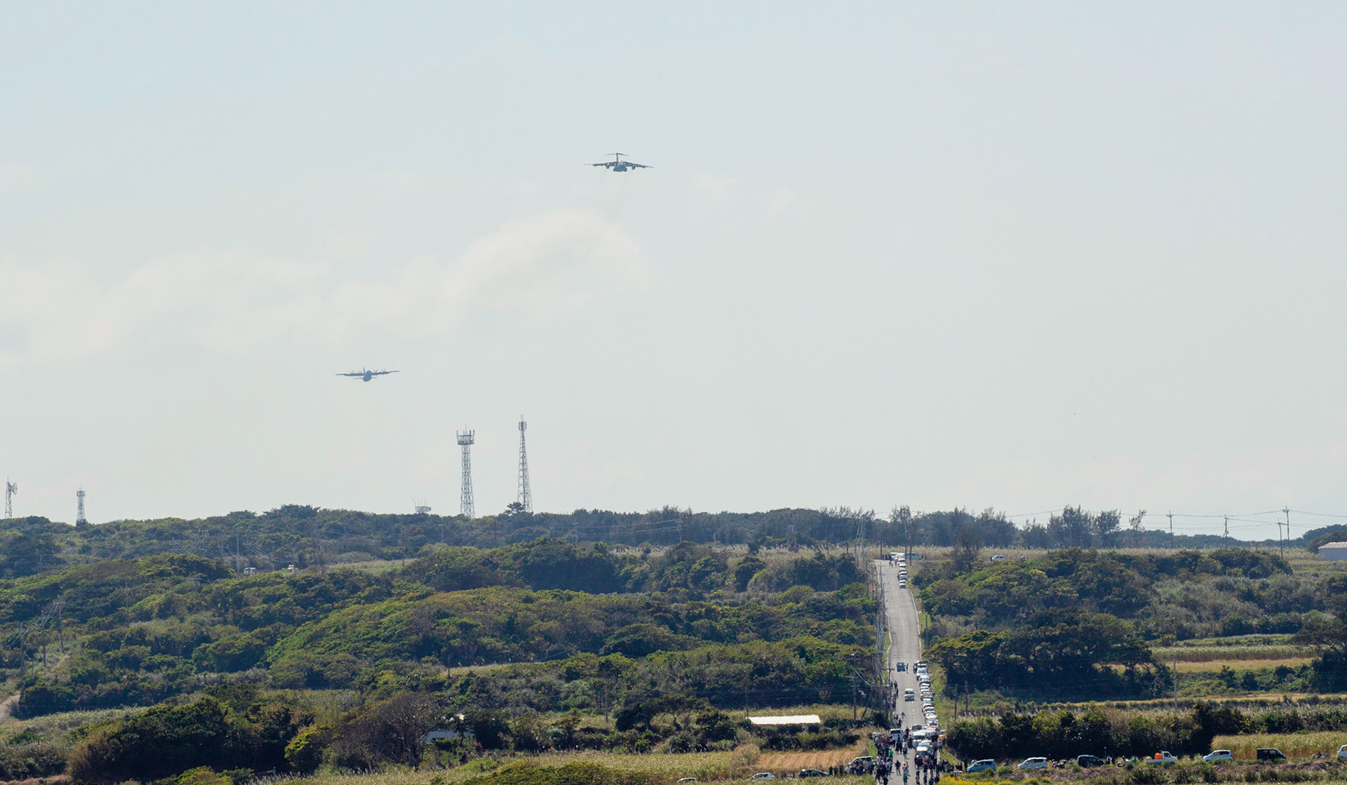 A Japan Air Self-Defense Force Kawasaki C-1 assigned to the 2nd Airlift Group and a U.S. Air Force C-130J Super Hercules assigned to the 36th Airlift Squadron, fly in formation during Field Training Exercise Iron Fist 23 over Kikaijima Island, Japan, March 3, 2023. During the exercise, the USAF and Japan Self-Defense Forces conducted simulated island seizure airborne operations as the U.S. Marine Corps performed a simultaneous amphibious assault onto the beachhead. (U.S. Air Force photo by Yasuo Osakabe)