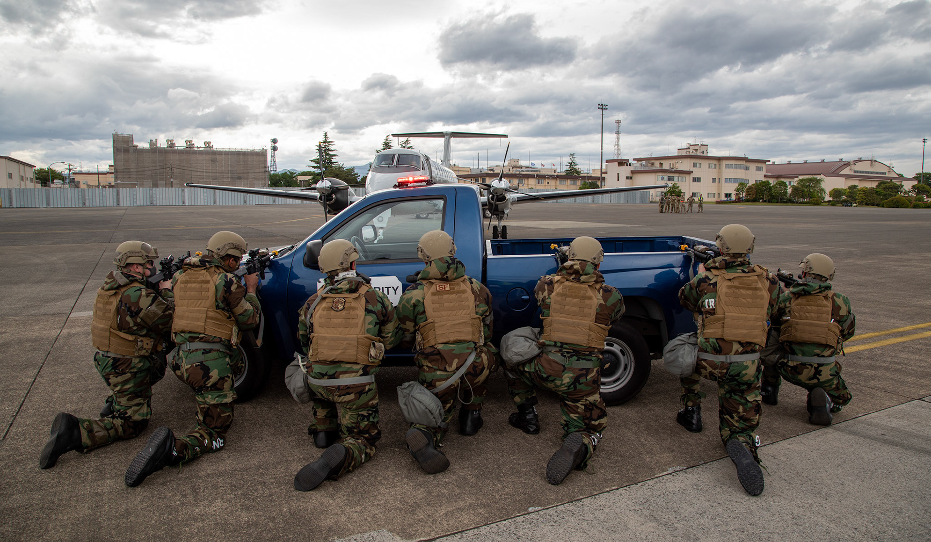 Patrolmen with the 374th Security Forces Squadron secure a C-12 Huron during an anti-hijacking exercise at Yokota Air Base, Japan, May 5, 2021. The Samurai Readiness Inspection showcases and ensures Yokota’s ability to provide war-winning airpower throughout the Indo-Pacific. (U.S. Air Force photo by Yasuo Osakabe)