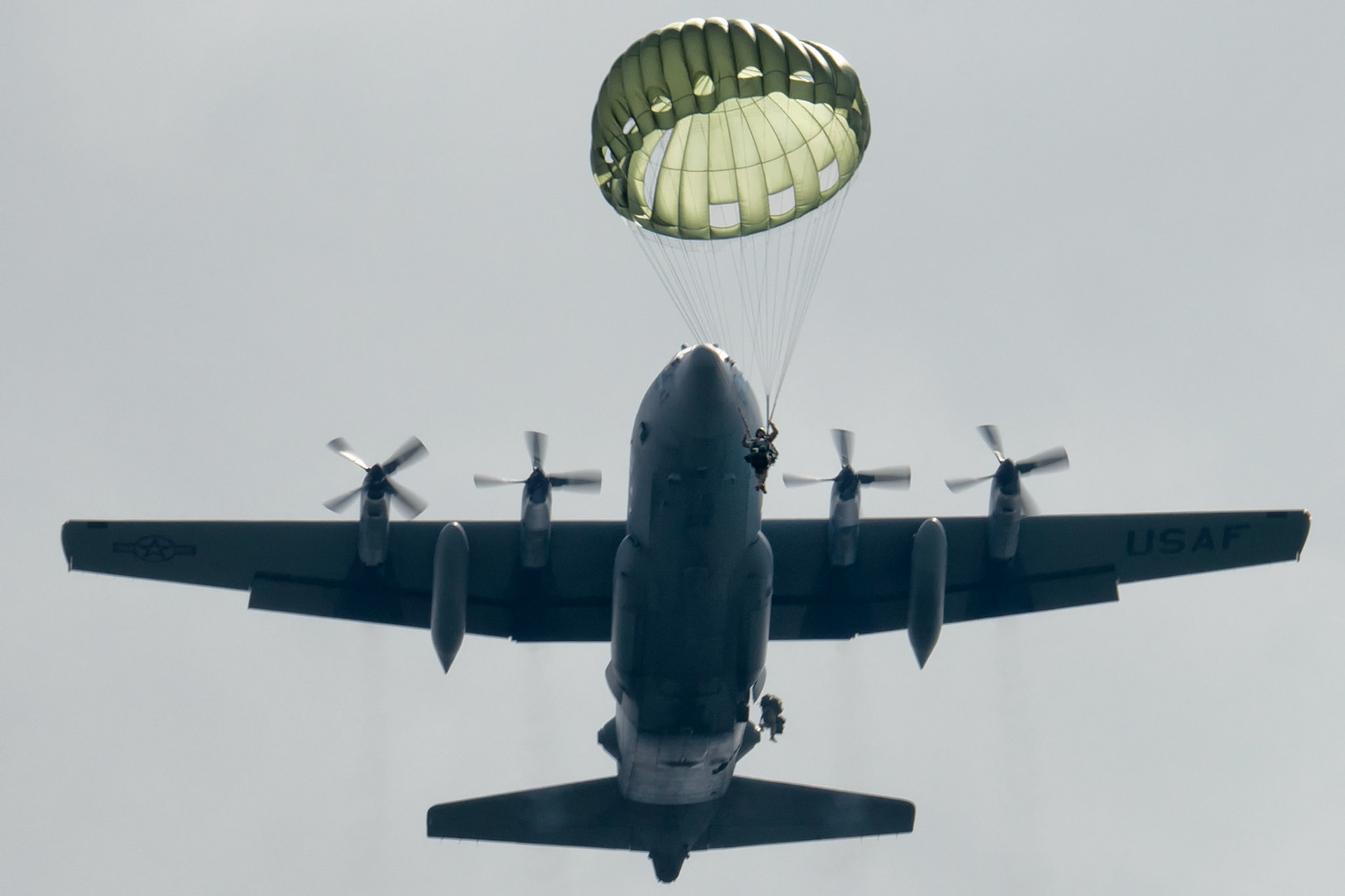 U.S. Solders execute jumps out of an Air Force C-130 Hercules, assigned the 36th Airlift Squadron at Combined Arms Training Center Camp Fuji, Japan, Sept. 3, 2014. The Soldiers are with the 1st Battalion, 1st Special Forces Group (Airborne). (U.S. Air Force photo by Osakabe Yasuo/Released)