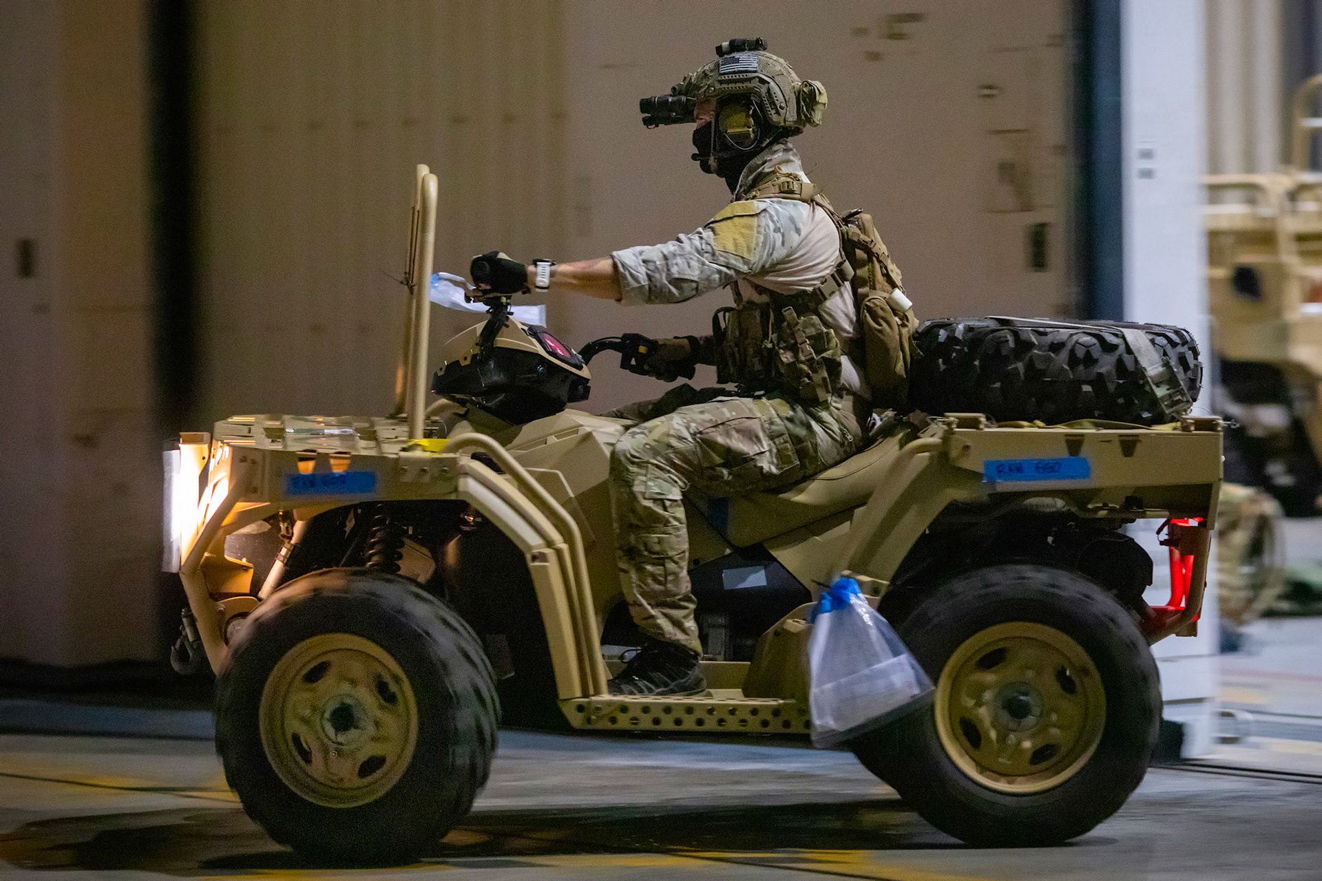 A U.S. Air Force Special Tactics operator assigned to the 320th Special Tactics Squadron out of Kadena Air Base, Japan, drives a tactical vehicle on the flightline, during Exercise Gryphon Jet at Yokota Air Base, Japan, June 23, 2020. Special Tactics is a U.S. Special Operation Command's tactical air and ground integration force, and the Air Force's special operations ground force, leading Global Access, Precision Strike, Personnel Recovery and Battlefield Surgery operations on the battlefield. Exercise Gryphon Jet is an integrated training exercise focused on improving interoperability throughout the special operations community. (U.S. Air Force photo by Yasuo Osakabe)