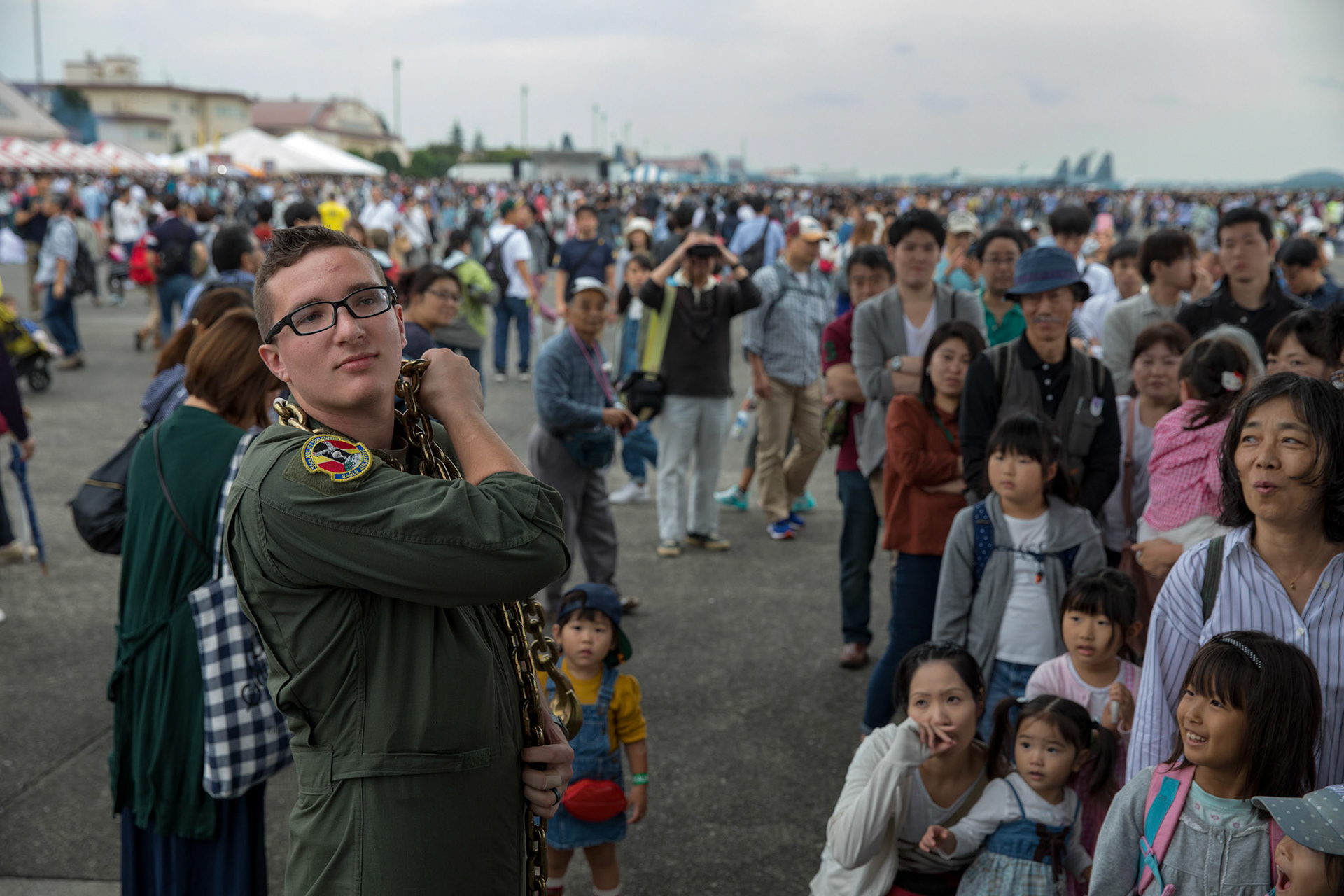Senior Airman Alexander Lauher, 36th Airlift Squadron C-130 loadmaster, lifts a heavy chain during the 2017 Japanese-American Friendship Festival at Yokota Air Base, Japan, Sept. 16, 2017. The festival not only provided Yokota's neighbors a taste of American fun, but also served to strengthen ties between Yokota and the local communities. Yokota welcomed approximately 75,000 visitors to the festival. (U.S. Air Force photo by Yasuo Osakabe)