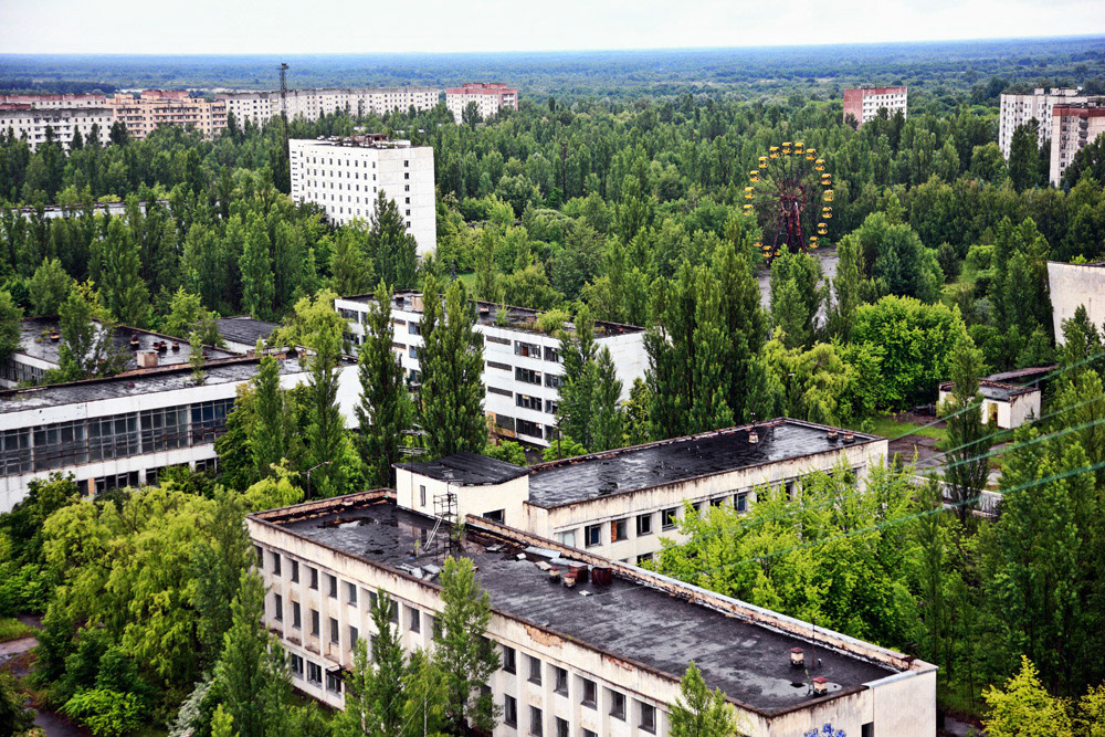 Pripyat is an abandoned city in the zone of alienation in northern Ukraine, Kiev Oblast, near the border with Belarus. The city was founded in 1970 to house the Chernobyl Nuclear Power Plant workers, and was abandoned in 1986 following the Chernobyl disaster. Its population had been around 50,000 prior to the accident. This view is from 16-storeyed building near by the center of Pripyat town.