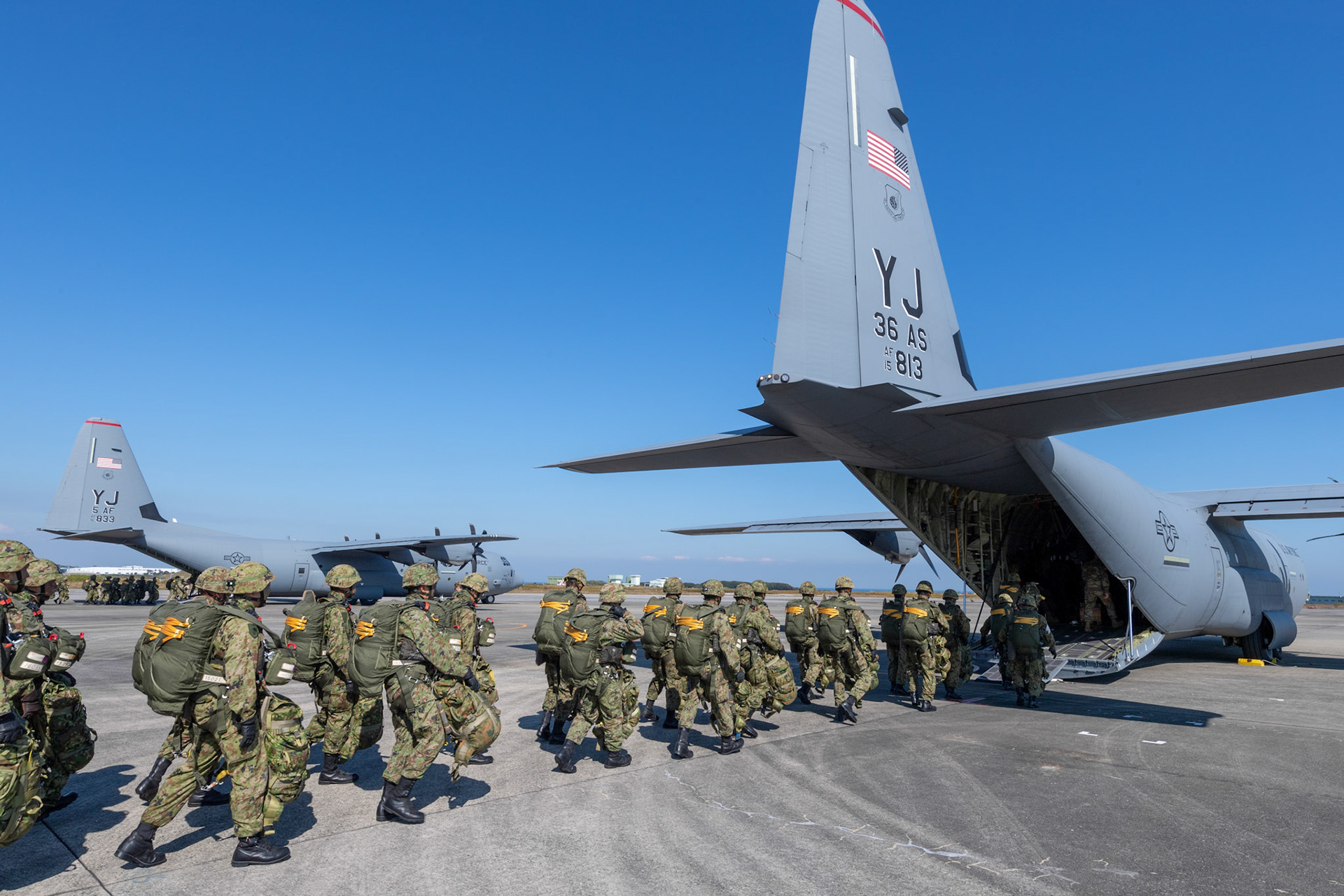 Japan Ground Self-Defense Force soldiers with the 1st Airborne Brigade prepareto board a U.S. Air Force C-130J Super Hercules assigned to the 36th Airlift Squadron at Japan Air Self-Defense Force Tsuiki Air Base, Japan, Nov. 4, 2018, during Keen Sword 19. Air Force C-130J Super Hercules’ with the 36 AS became the first U.S. aircraft to drop Japan Ground Self-Defense Force soldiers on Hiju-dai drop zone, Oita prefecture, Japan. (U.S. Air Force photo by Yasuo Osakabe)
