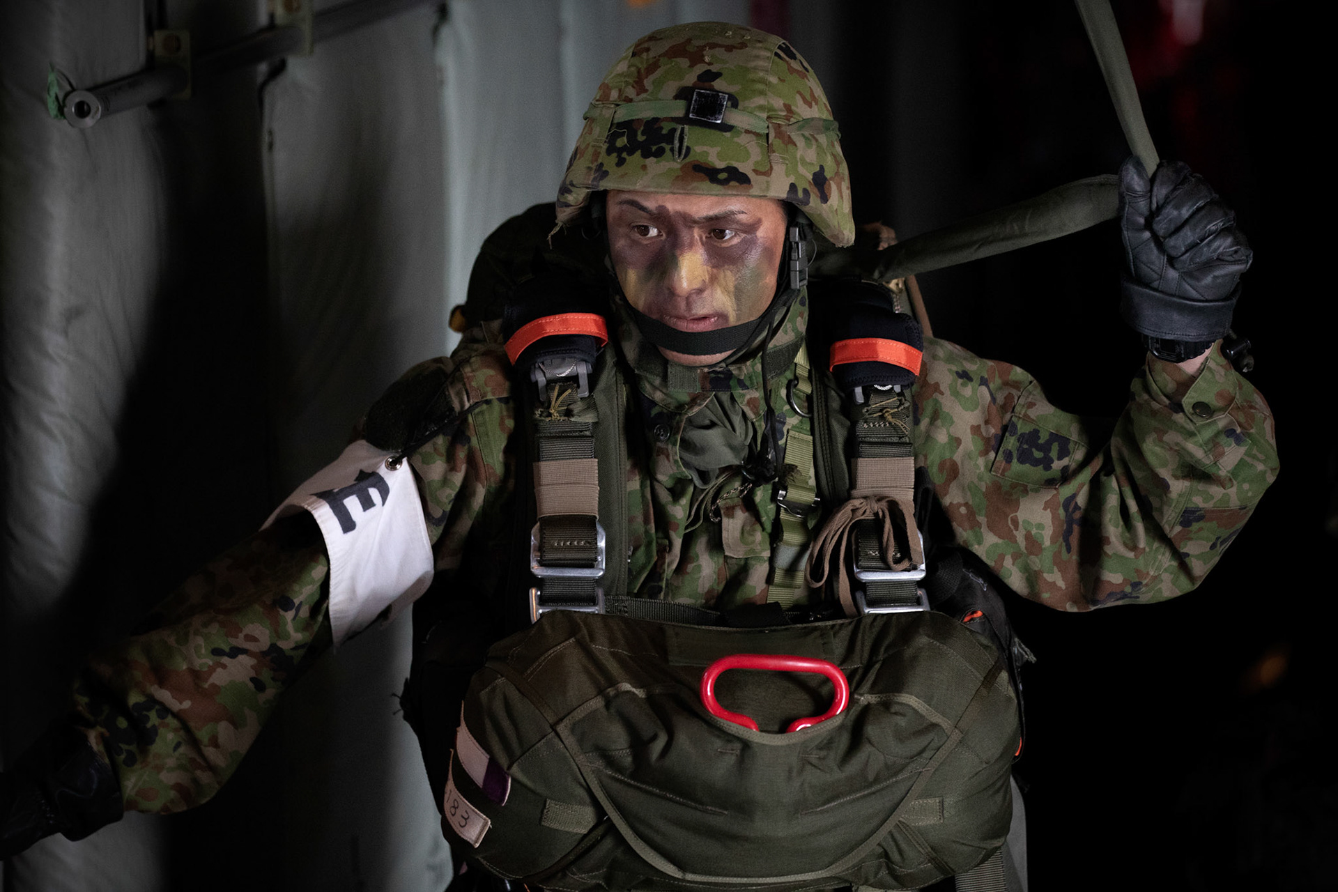 A Japan Ground Self-Defense Force soldier assigned to the 1st Airborne Brigade concentrates himself before jumping from a U.S. Air Force C-130J Super Hercules assigned to the 36th Airlift Squadron over Hiju-dai drop zone, Oita prefecture, Japan, Nov. 4, 2018, during Keen Sword 19. Approximately 280 JGSDF personnel conducted jump training from U.S. Air Force C-130J Super Hercules’ for the first time in Japan. (U.S. Air Force photo by Yasuo Osakabe)