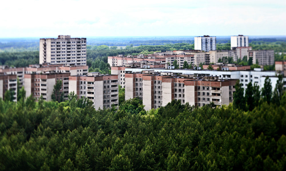 Pripyat is an abandoned city in the zone of alienation in northern Ukraine, Kiev Oblast, near the border with Belarus. The city was founded in 1970 to house the Chernobyl Nuclear Power Plant workers, and was abandoned in 1986 following the Chernobyl disaster. Its population had been around 50,000 prior to the accident. This view is from 16-storeyed appartment near by the center of Pripyat town