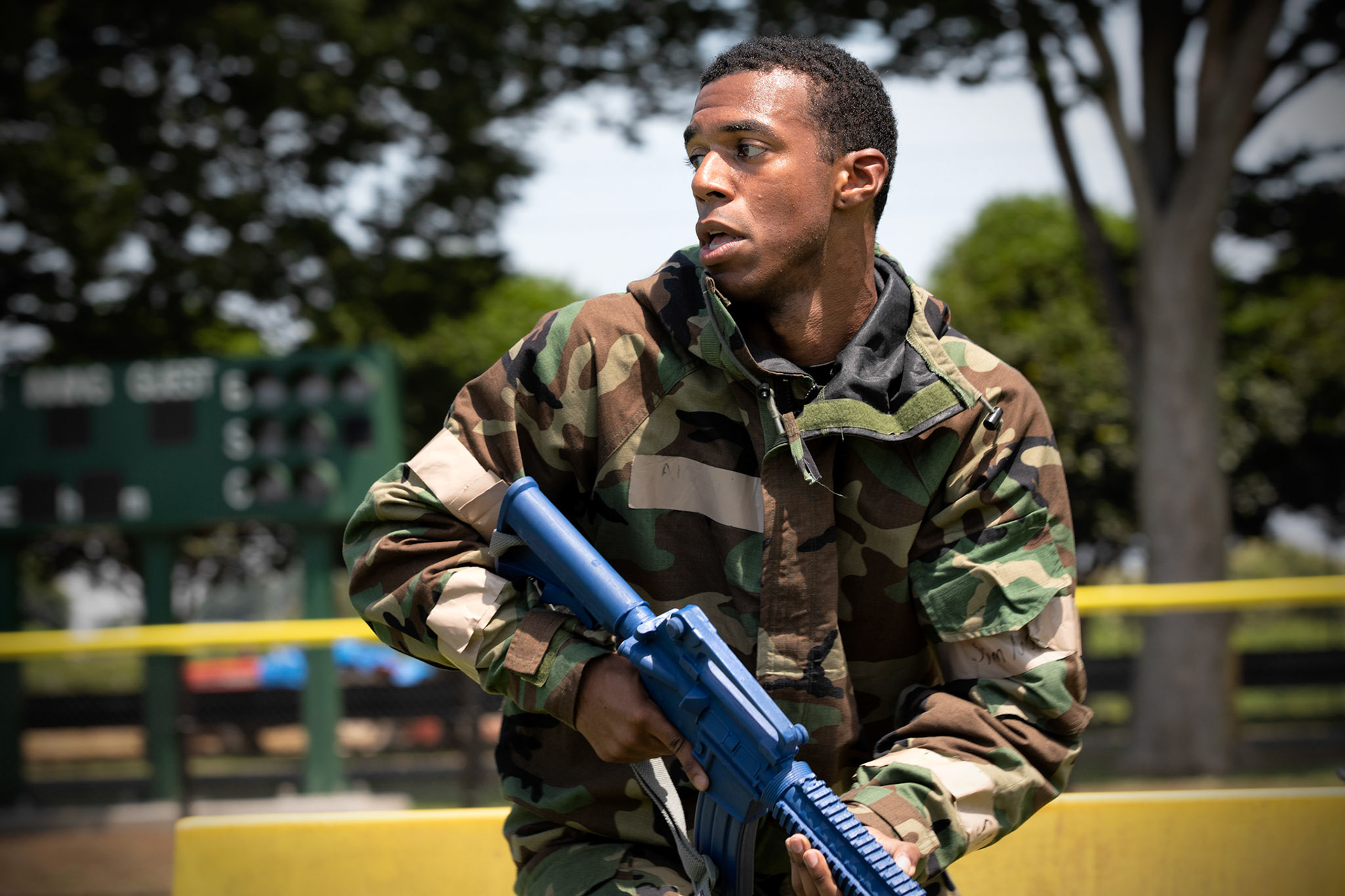 Senior Airman Antonio Gant, 374th Civil Engineer Squadron armorer, sprints into position during an Ability to Survive and Operate (ATSO) Rodeo at Yokota Air Base, Japan, June 8, 2018. The rodeo involved participants wearing different stages of mission-oriented protective posture (MOPP) gear after pushing a Humvee and going through various areas of training including self-aid and buddy care, post-attack reconnaissance, four-person relay, and "shoot, move and communicate." (U.S. Air Force photo by Yasuo Osakabe)