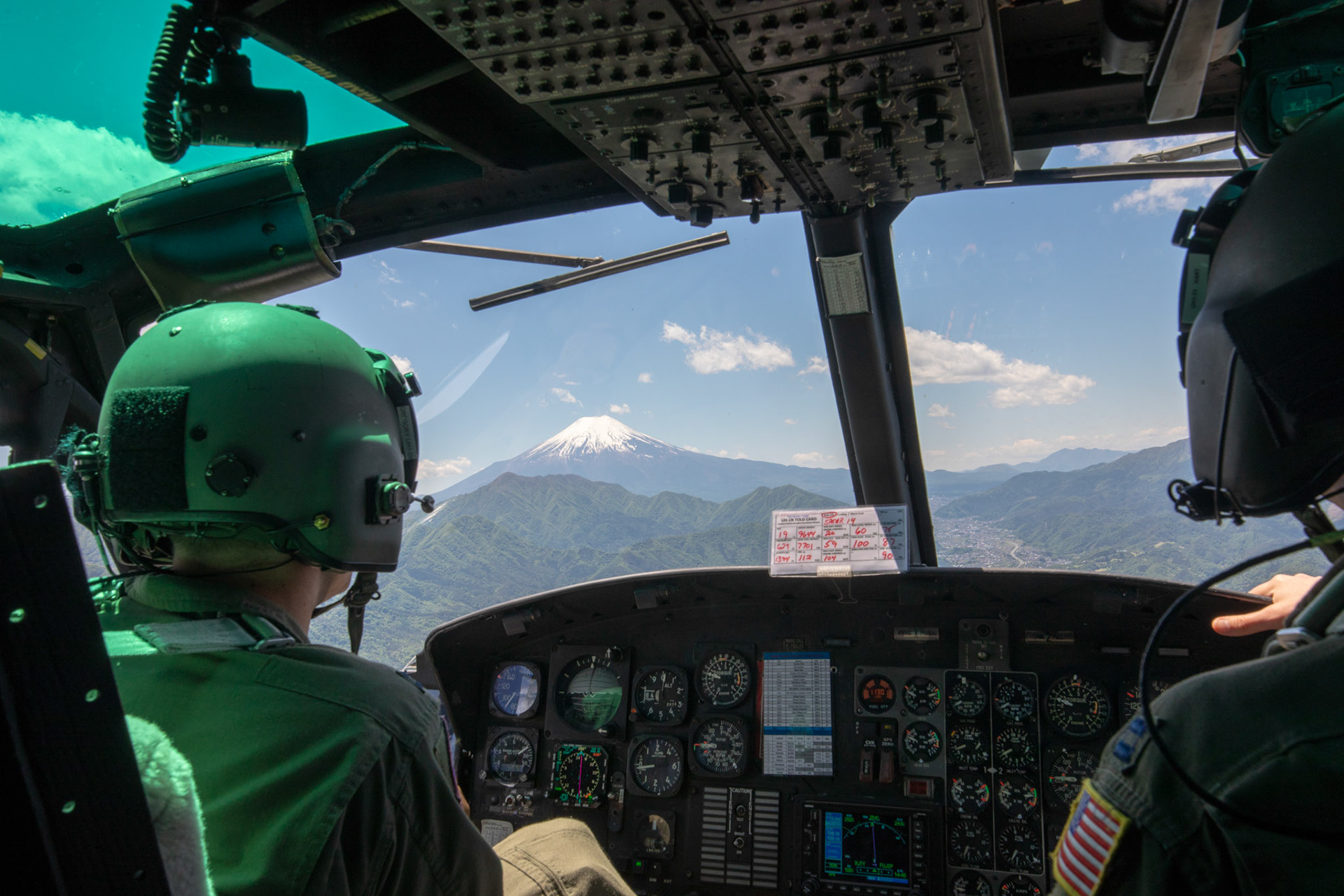 UH-1N Iroquois pilots from the 459th Airlift Squadron fly over Yamanashi Prefecture, Japan, during the 374th Airlift Wing Generation Exercise, May 4, 2018. This part of the exercise was conducted in order to demonstrate the wing’s ability to complete a formation flight with multiple aircraft. (U.S. Air Force photo by Yasuo Osakabe)