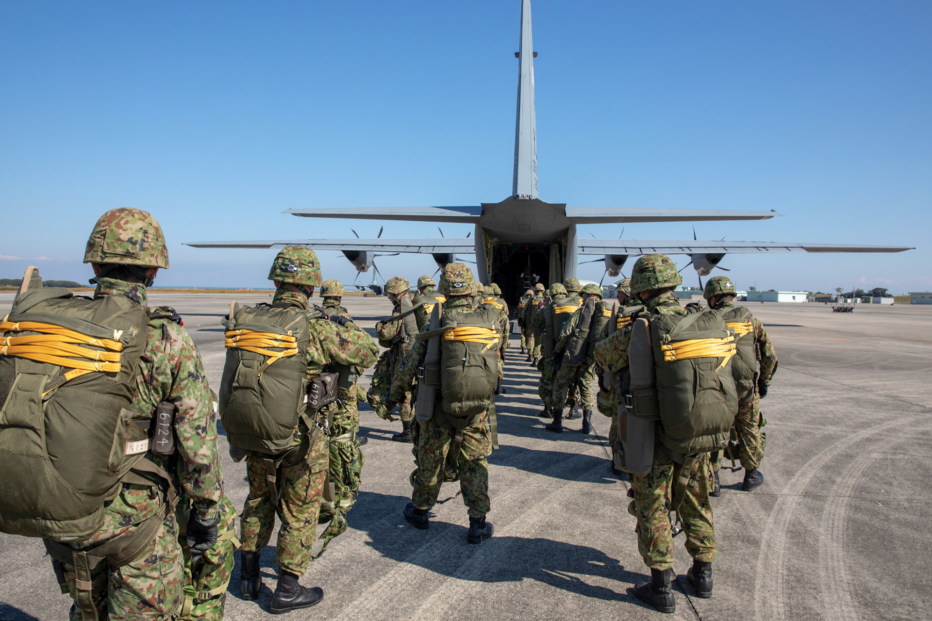 Japan Ground Self-Defense Force soldiers assigned to the 1st Airborne Brigade board a U.S. Air Force C-130J Super Hercules assigned to the 36th Airlift Squadron at Japan Air Self-Defense Force Tsuiki Air Base, Japan, Nov. 4, 2018, during Keen Sword 19. Air Force C-130J Super Hercules’ from the 36 AS became the first U.S. aircraft to drop JGSDF soldiers on Hiju-dai drop zone, Oita prefecture, Japan. (U.S. Air Force photo by Yasuo Osakabe)