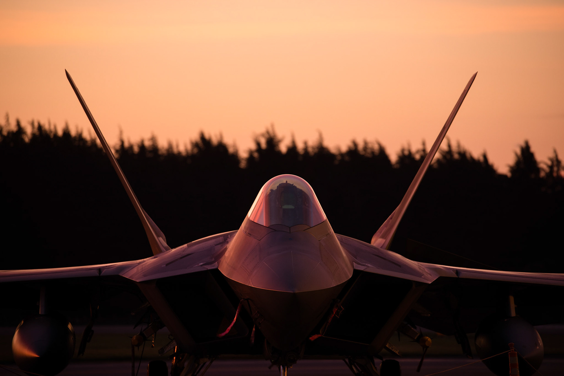 A U.S. Air Force F-22 Raptor from Joint Base Elmendorf-Richardson, Alaska, sits on the flightline, July 8, 2018, at Yokota Air Base, Japan. Eight F-22s evacuated from Kadena Air Base, Japan due to Typhoon Maria. The F-22 is being deployed under U.S. PACOM’s theater security package (TSP) program, which has been in operation since 2004.  (U.S. Air Force photo by Yasuo Osakabe)