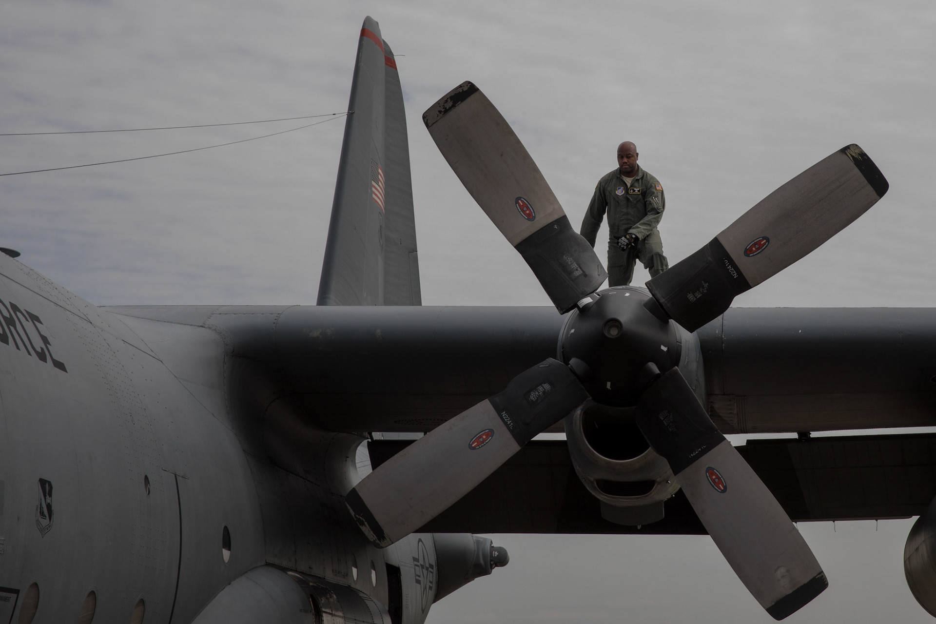 Tech. Sgt. Joshua Pittman, 36th Airlift Squadron C-130H flight engineer, inspects the left outboard motor bay of a C-130H Hercules, at Yokota Air Base, Japan, Oct. 5, 2017. This is the last active duty C-130H Hercules tactical training sortie. (U.S. Air Force photo by Yasuo Osakabe)