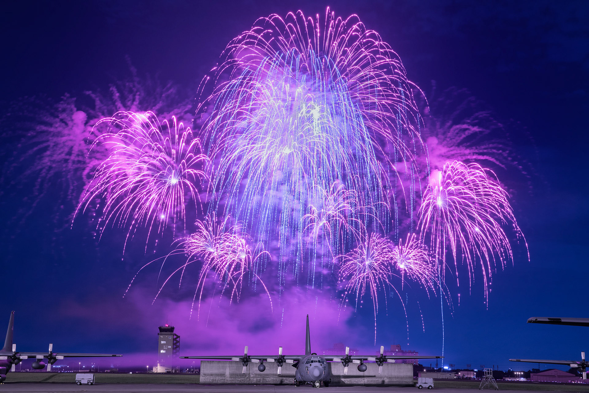 Fireworks explode behind C-130 Hercules during Celebrate America, June 30, 2017, at Yokota Air Base, Japan. Celebrate America is an annual event that provides military members and their families the opportunity to enjoy games, food and bands before culminating in a fireworks display over the Yokota airfield to celebrate Independence Day. (U.S. Air Force photo by Yasuo Osakabe)
