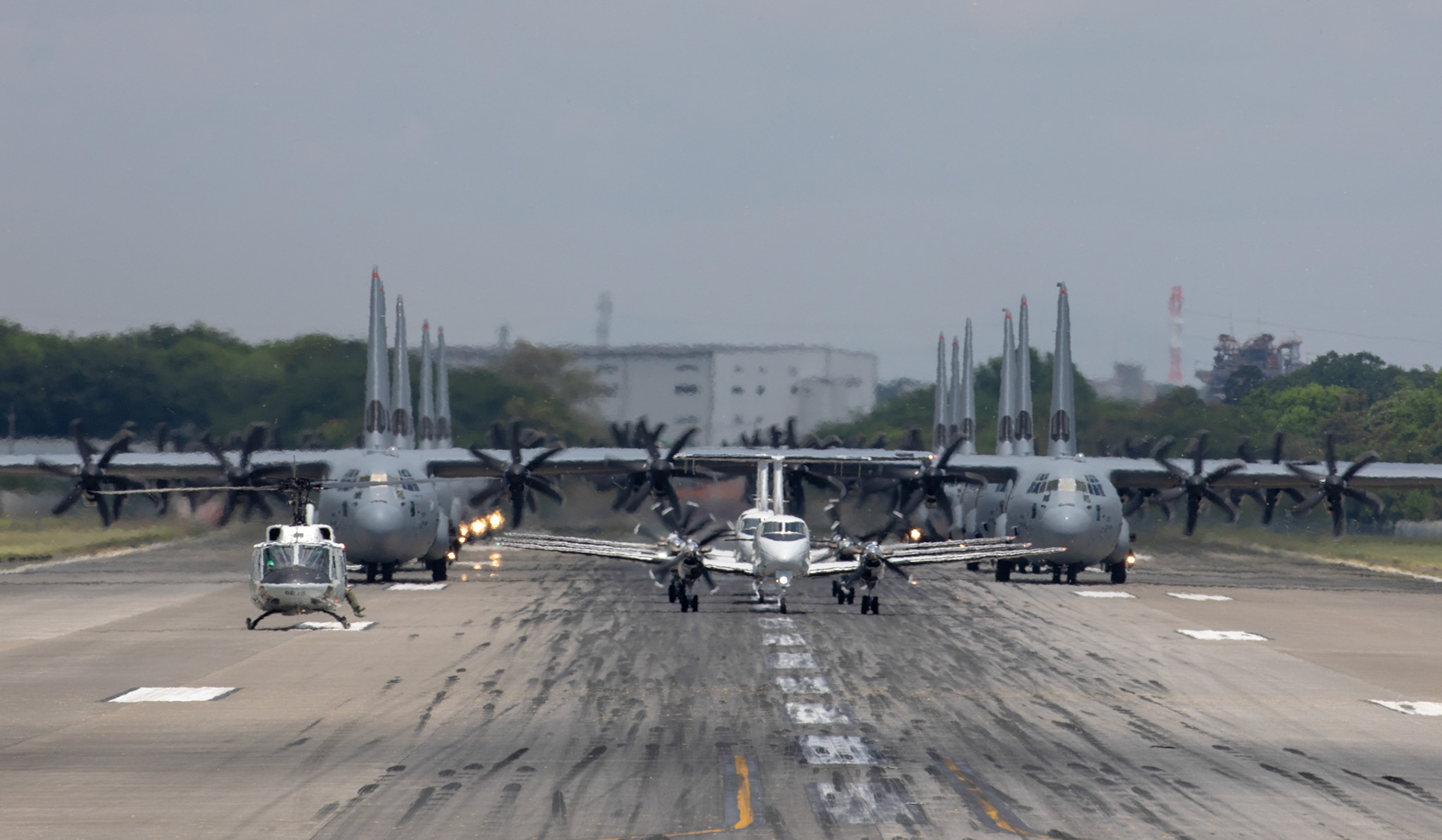 Aircraft from the 374th Airlift Wing (AW) conduct the 374th AW Generation Exercise Elephant Walk at Yokota Air Base, Japan, May 4, 2018. The 374th AW conducted the exercise to train the wing’s ability to rapidly provide humanitarian aid and disaster relief throughout the Indo-Pacific region. (U.S. Air Force photo by Yasuo Osakabe)