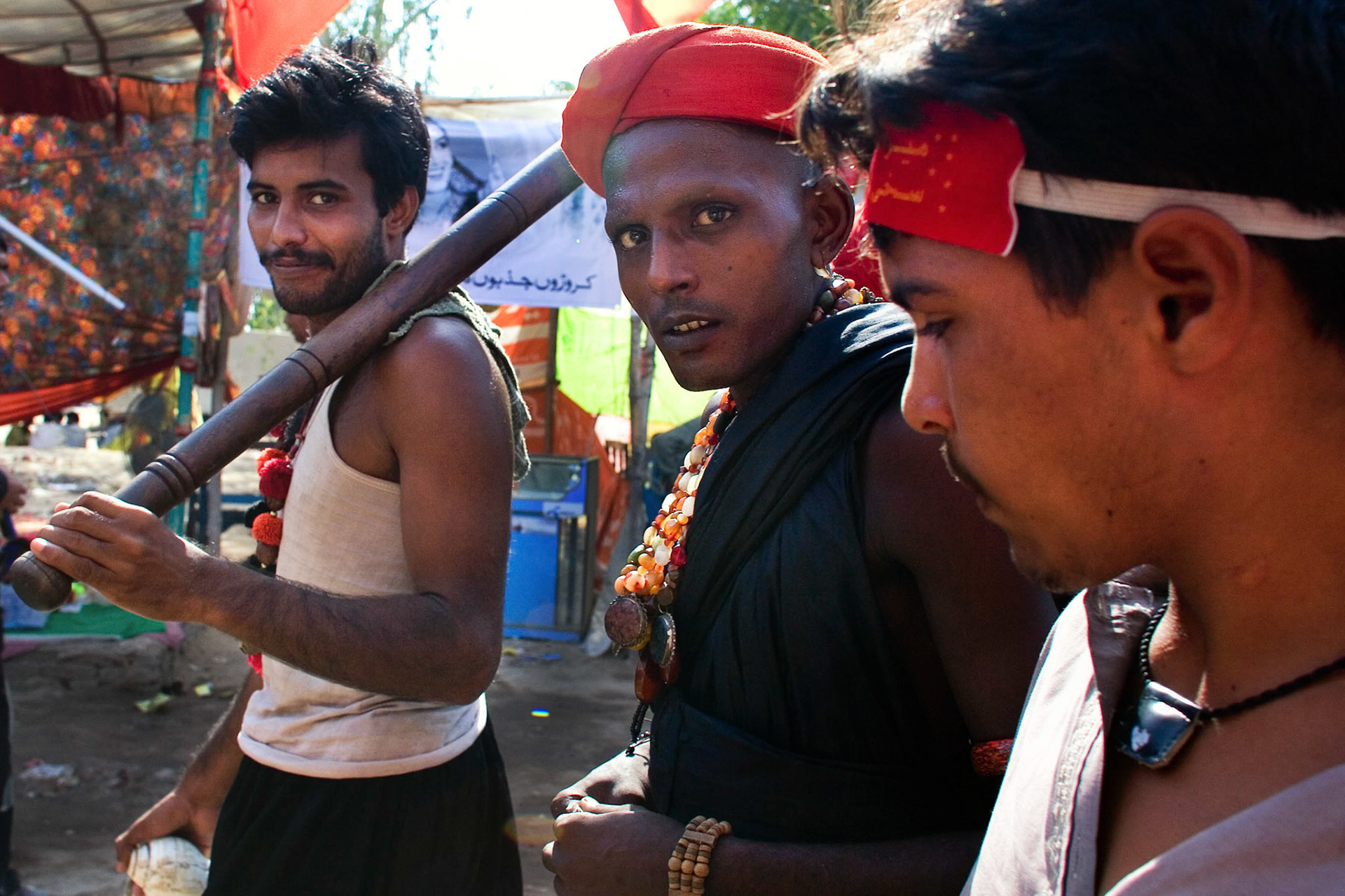 Sumandar ail sain (centre) showed us the pilgrim village in Lalbaug. (Travel)