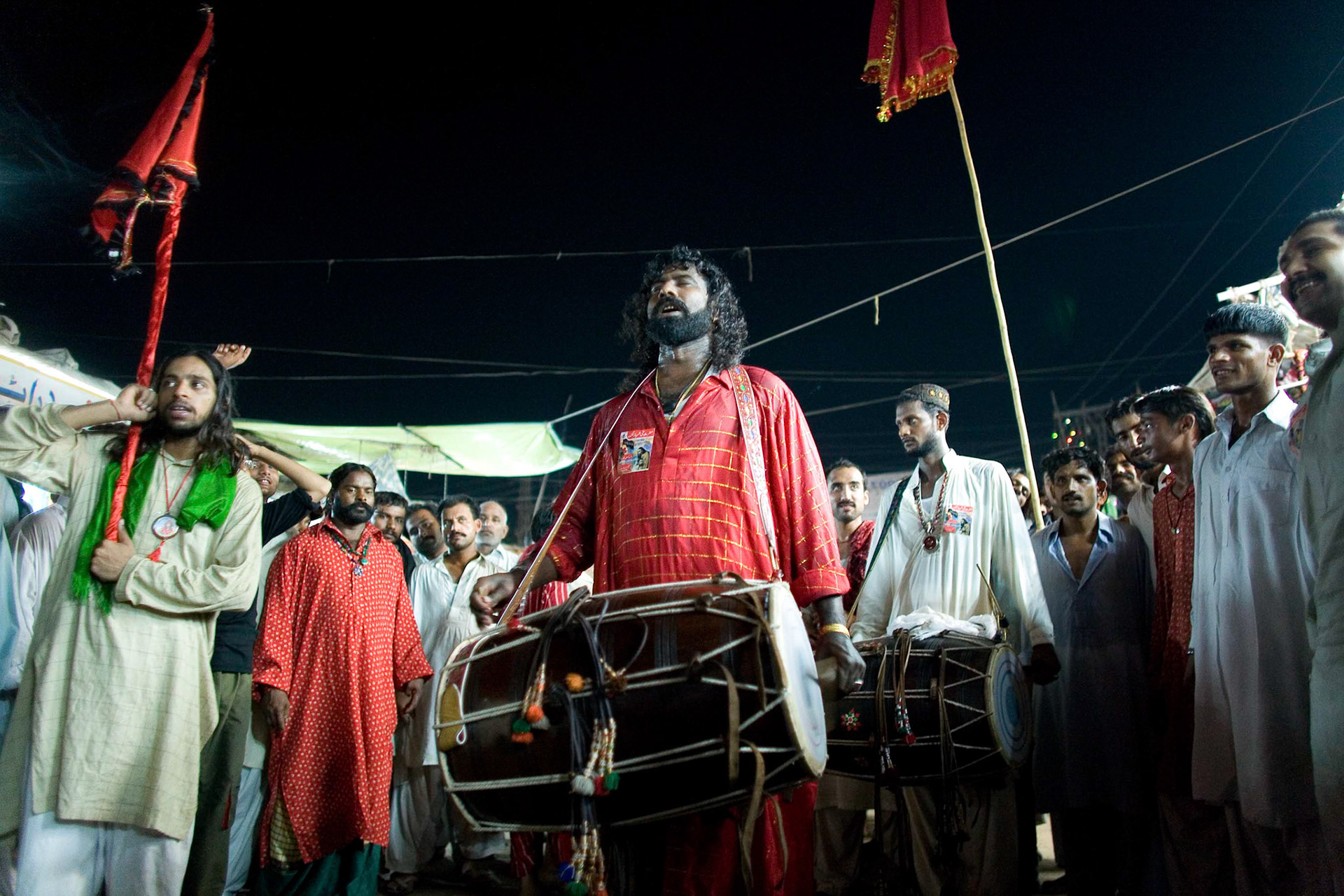 Gonga sain (centre) and Mithu sain (back) played a tributed beat for dedicating their devotion to the great sufi saint, Hazrat Lal Shahbaz Qalandar, (Travel)
