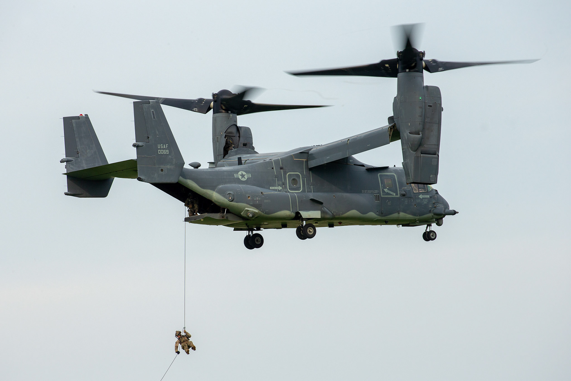 U.S. Special Operations Forces member repels onto the deck of a ship from a U.S. Air Force CV-22 Osprey assigned to the 21st Special Operations Squadron during Exercise Gryphon Jet at Yokota Air Base, Japan, June 15, 2020. Gryphon Jet is an integrated training exercise focused on improving interoperability throughout the special operations community. (U.S. Air Force photo by Yasuo Osakabe)