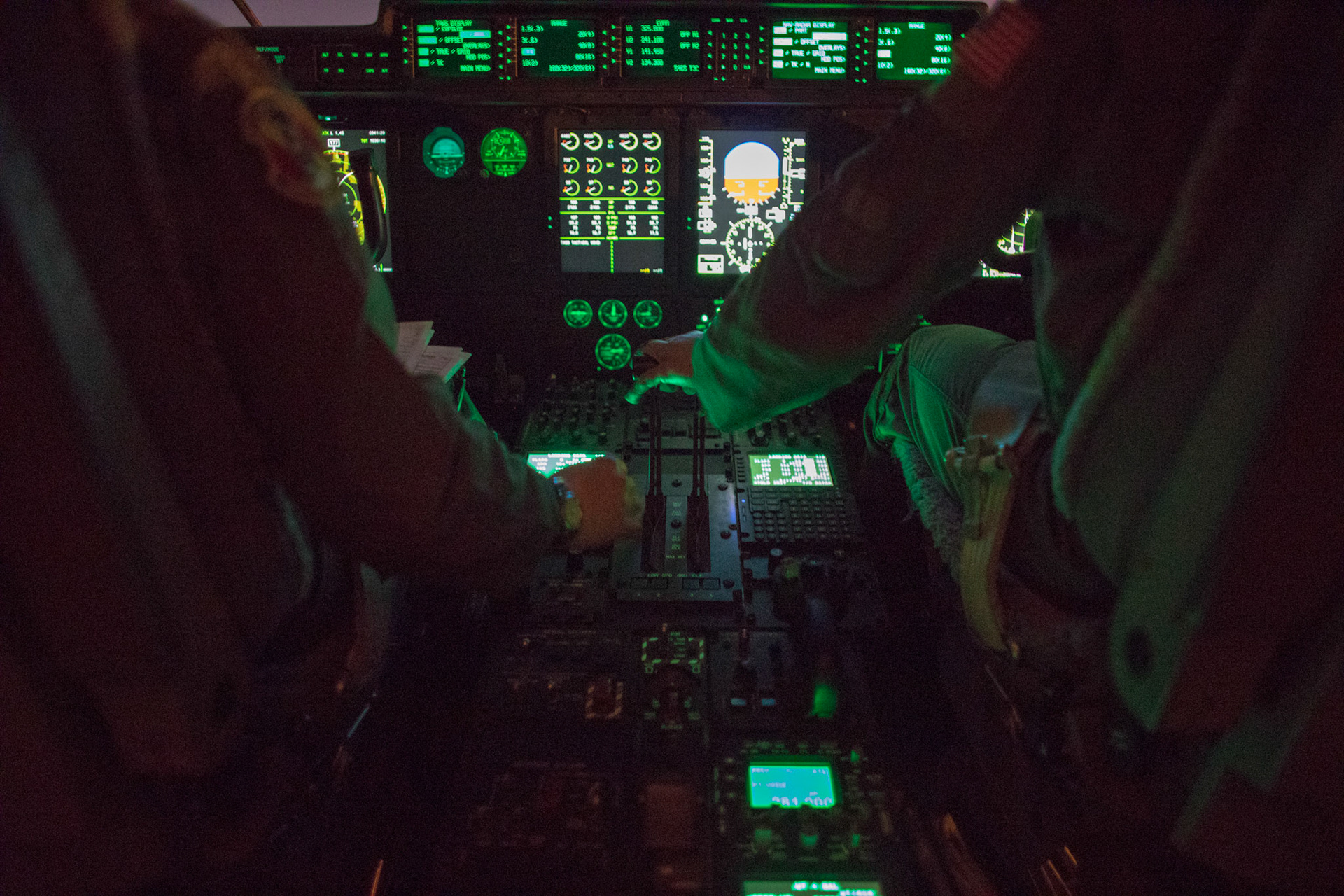 (Left to right) Capt. Andrew Huddleston and Maj. Christopher Carlen, the 36th Airlift Squadron C-130J pilots, approve the runway in a C-130J Super Hercules during a training mission at Yokota Air Base, Japan, March 26, 2018. Yokota aircrews regularly conduct night flying operations to ensure they are prepared for a variety of contingencies throughout the Indo-Asia Pacific region. (U.S. Air Force photo by Yasuo Osakabe)