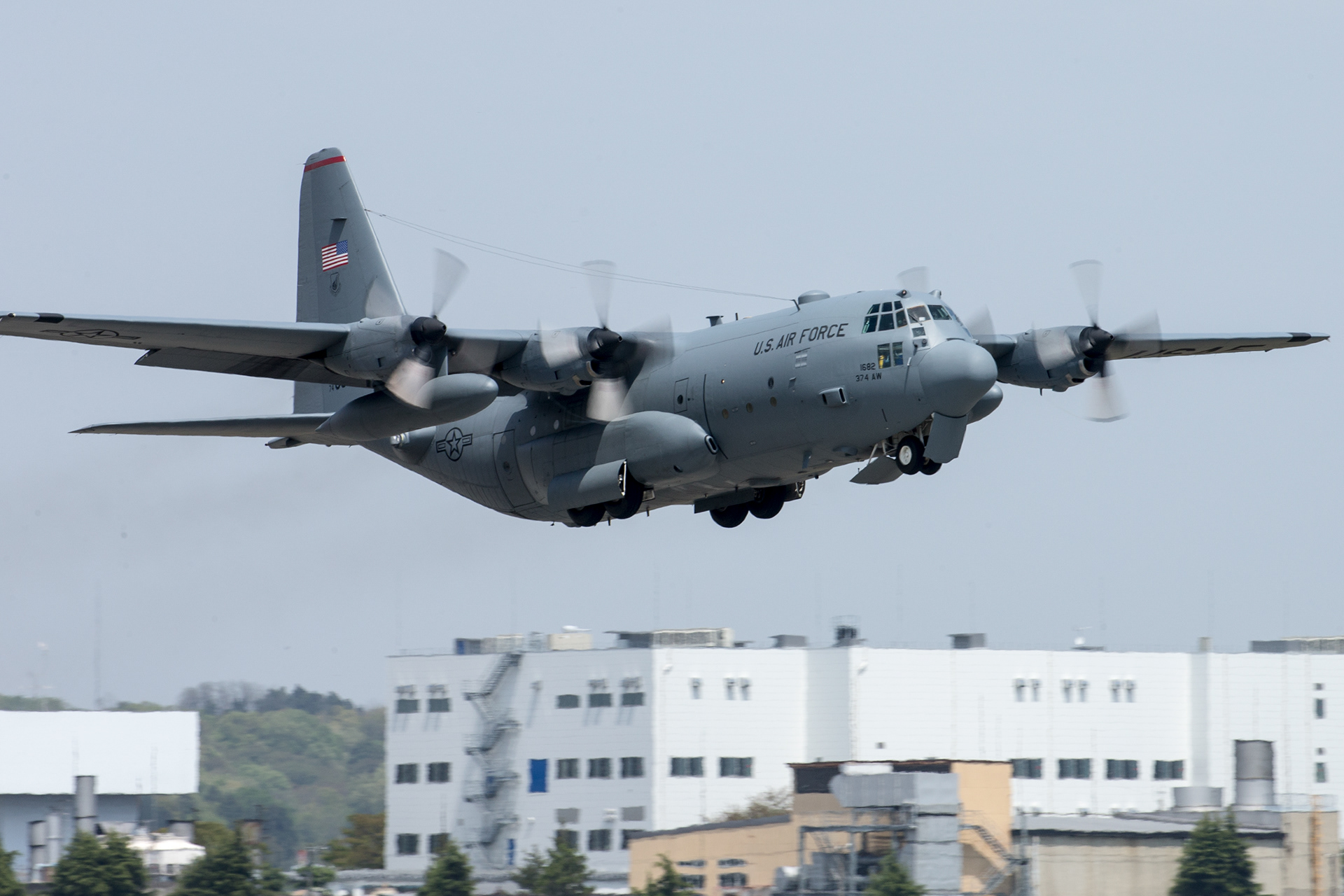 A C-130 Hercules takes off  from Yokota Air Base