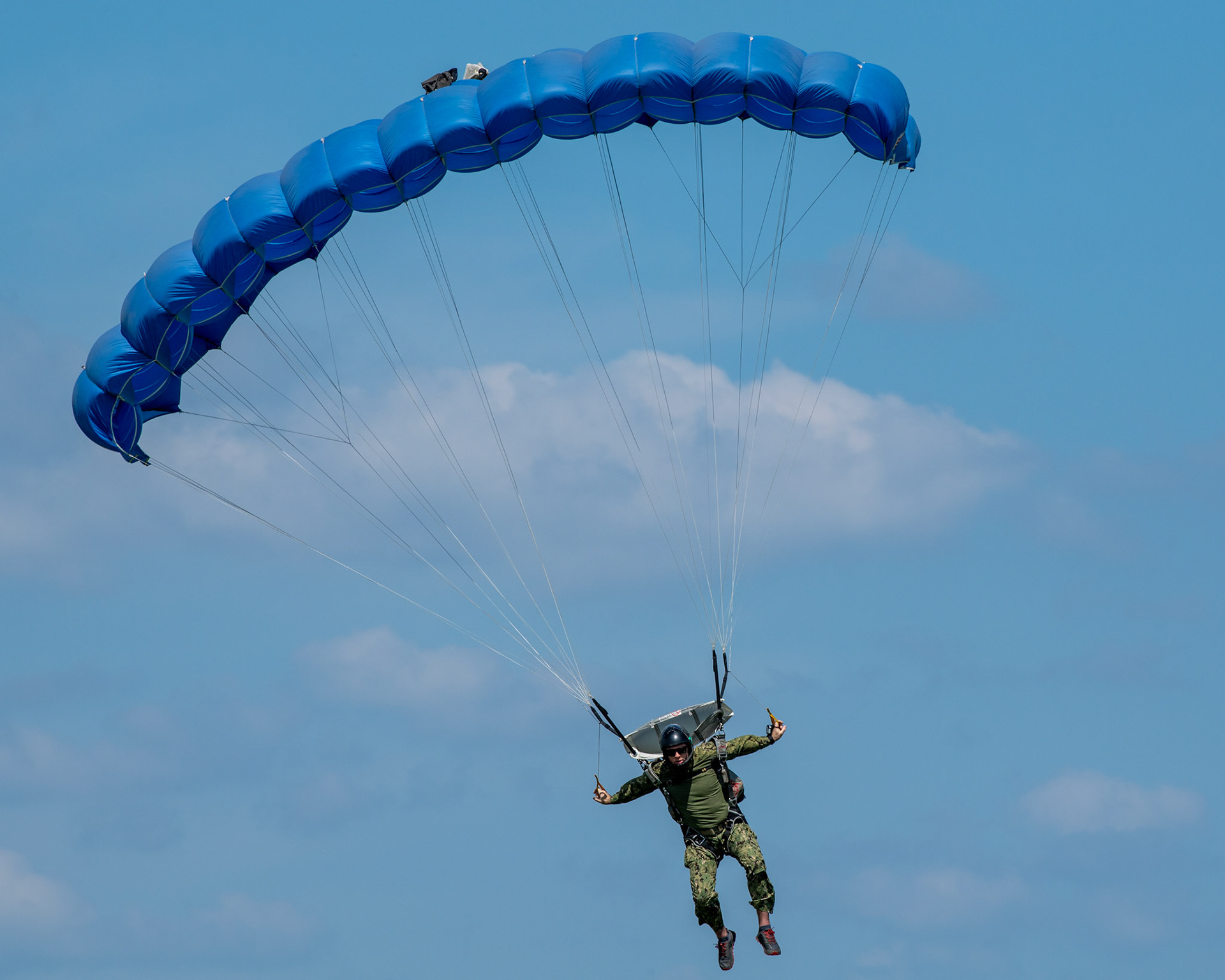 A member of U.S. Navy SEAL (Sea, Air and Land) Team One parachutes from a U.S. Air Force C-130J Super Hercules over Yokota Air Base, Japan, June 17, 2020, during Exercise Gryphon Jet. Gryphon Jet is an integrated training exercise focused on improving interoperability throughout the special operations community. (U.S. Air Force photo by Yasuo Osakabe)