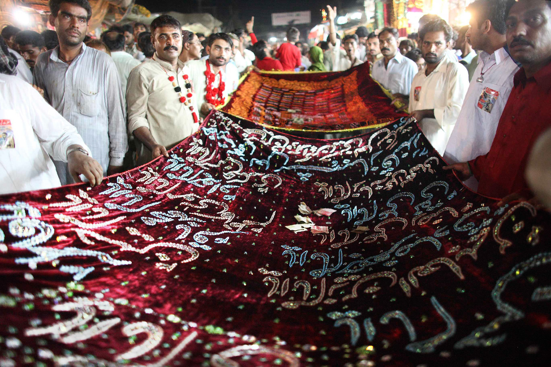 Devotees made their way to the shrine to commune with the saint, offer their tributes and make a wish. On the final day of Urs of Hazrat Lal Shahbaz Qalandar, thousands of pilgrims and devotees were going to present a long red chadar (a cloth used to cover a tomb) with Quranic verse in silver or gold threads. (Travel)