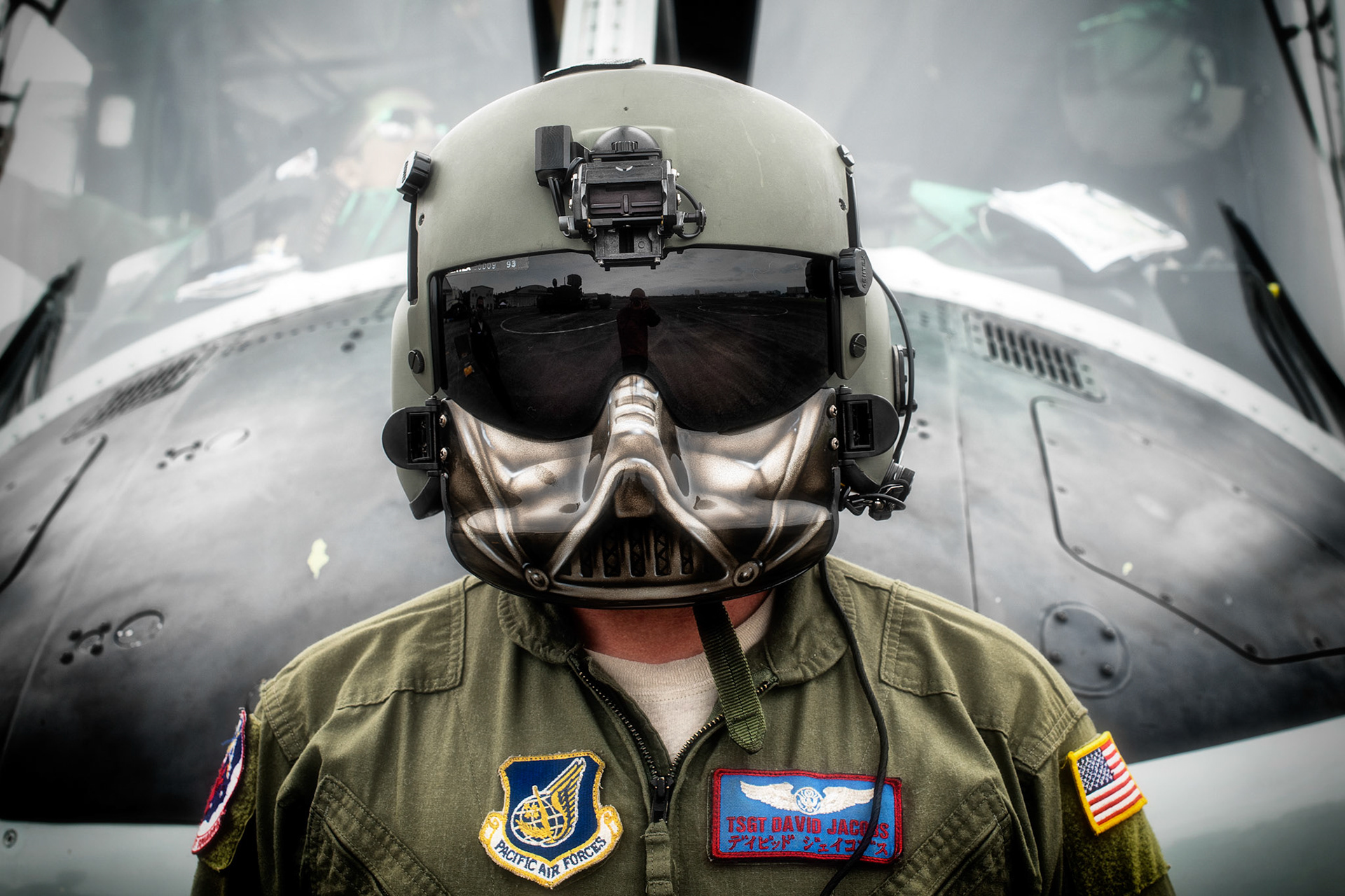 U.S. Air Force Tech. Sgt. David Jacob, 459th Airlift Squadron special mission aviator, stands in front of a UH-1N Iroquois during the 43rd Anniversary Event of Japan Ground Self-Defense Force Camp Tachikawa at JGSDF Camp Tachikawa, Japan, Oct. 1, 2016.  JGSDF UH-1Js assigned to Eastern Army Helicopter demonstrated formation flight, hoist demonstrate and disaster relief demonstration with first responders. Service members with the 459th Airlift Squadron from Yokota Air Base and Army Aviation Battalion from Camp Zama participated in the festival. (U.S. Air Force photo by Yasuo Osakabe/Released)