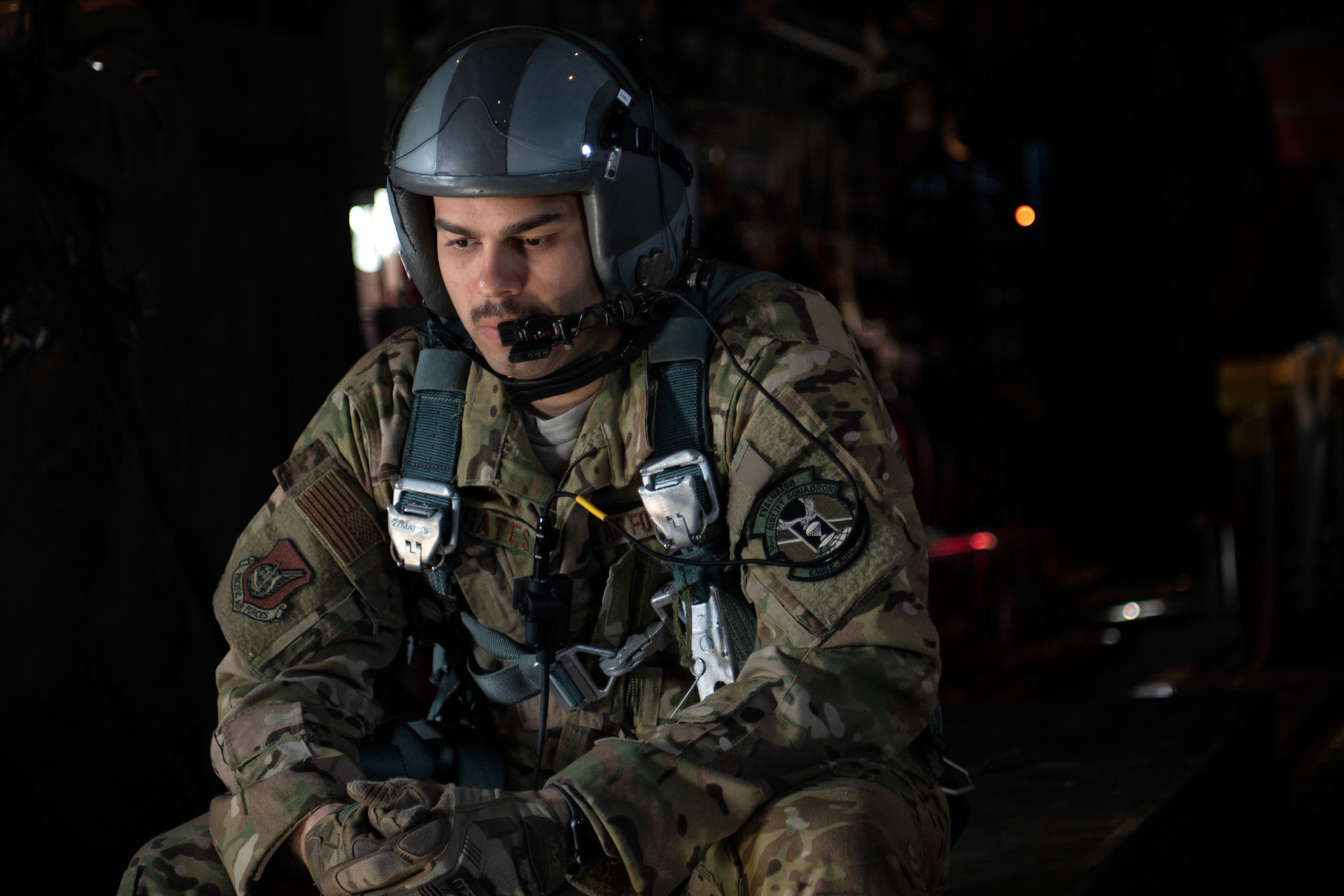 Tech. Sgt. Brian Gates, 36th Airlift Squadron C-130J loadmaster, speaks on the radio with crewmembers over the Kanto Plain, March 22, 2019, during the Yokota C-130J Rodeo. The Rodeo is a tactical airlift competition between flights within the 36th Airlift Squadron and 374th Operations Support Squadron, whose goal is to demonstrate capabilities, improve procedures, and enhance standardization for global operations.  (U.S. Air Force photo by Yasuo Osakabe)