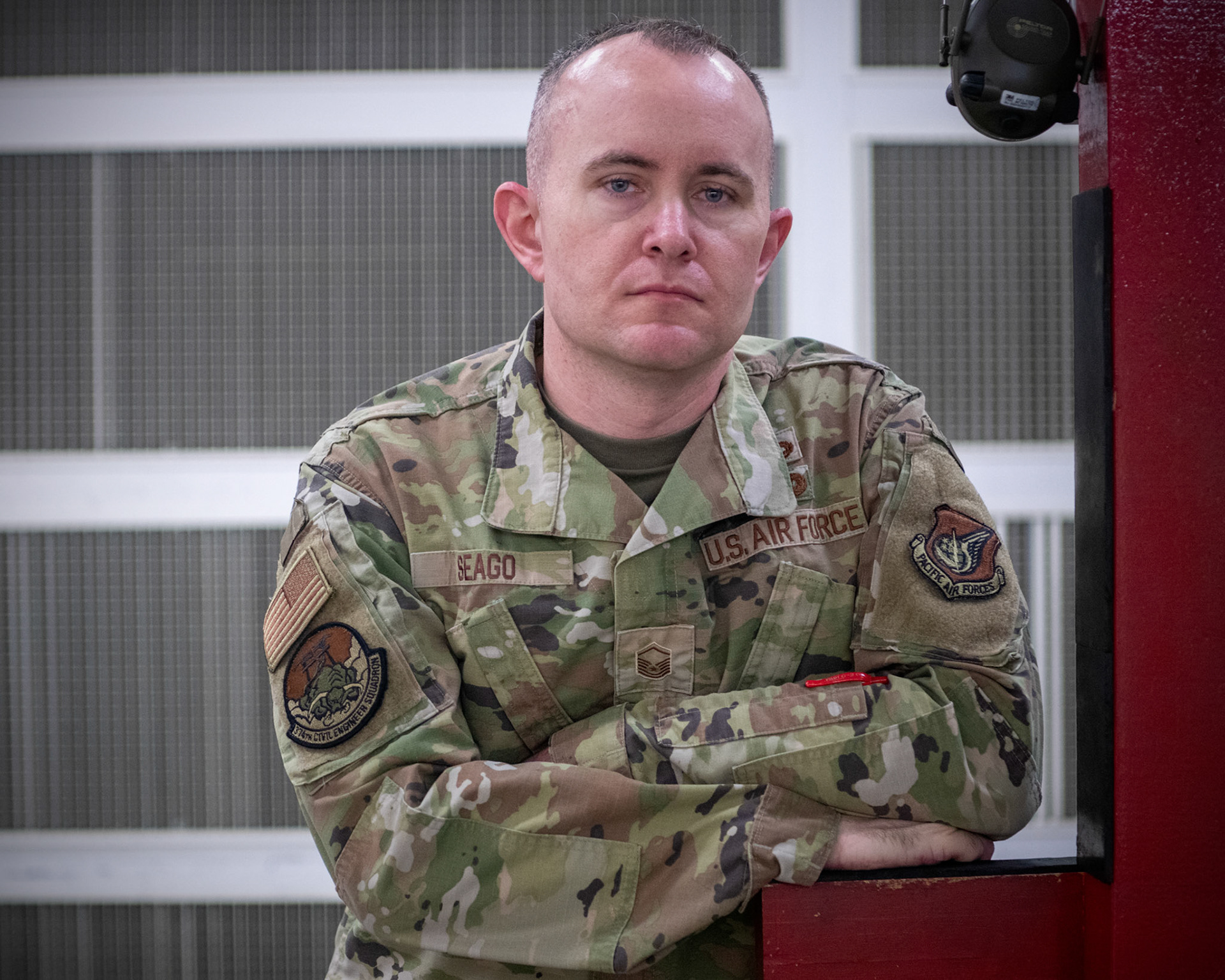 Master Sgt. Michael Seago, 374th Civil Engineer Squadron heavy repair superintendent, waits for his score after an Excellence-In-Competition M9 Beretta pistol at Yokota Air Base, Japan, April 12, 2022. The four-day competition was held to boost morale and test 165 active-duty military members on how accurate they can shoot their authorized duty pistols. The top 10% scorers will earn the Air Force Excellence In Competition medal to wear on the Service Dress Uniform. (U.S. Air Force photo by Yasuo Osakabe)