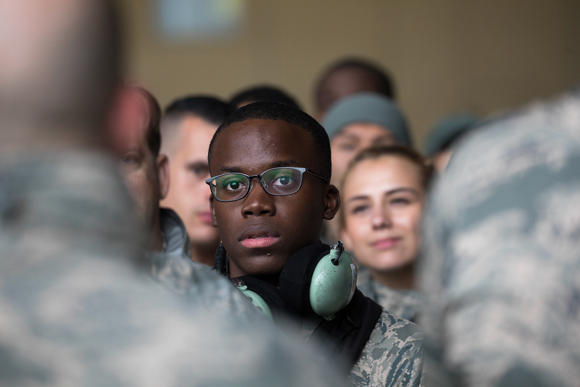 Airman Scottie Reed, 374th Aircraft Maintenance Squadron crew chief, listens to a speech by Maj. David Mueller, 374th AMXS commander, during the official C-130H Hercules farewell ceremony at Yokota Air Base, Japan, Oct. 16, 2017. Yokota was the last active-duty location to to operate the C-130H. (U.S. Air Force photo by Yasuo Osakabe)