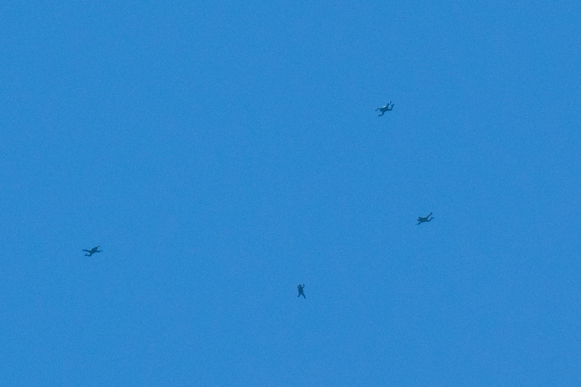 Japan Ground Self-Defense Force paratroopers assigned to the 1st Airborne Brigade conduct a military free fall from a U.S. Air Force C-130J Super Hercules during the Japanese-American Friendship Festival at Yokota Air Base, Japan, May 22, 2022. A six member team comprised of U.S. Air Force and JGSDF paratroopers, conducted a military free fall demonstration to show their capabilities during the festival. During the two-day festival, more than 110,000 attendees came to Yokota to experience the event. The festival is aimed at increasing bilateral relationships between U.S. and Japanese communities and allows people to see U.S. and Japanese military capabilities first-hand. (U.S. Air Force photo by Yasuo Osakabe)