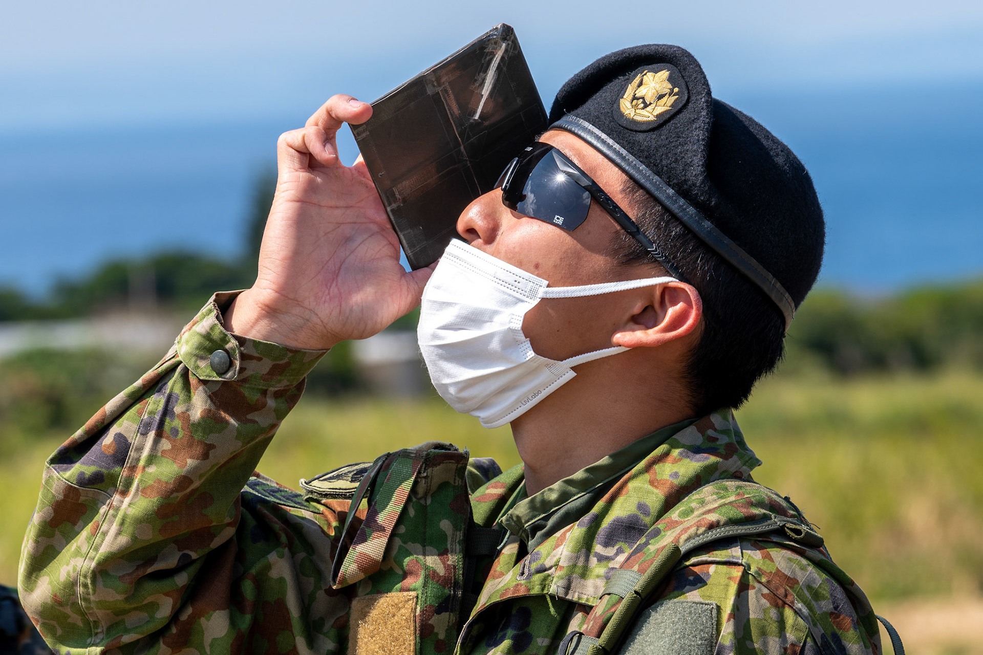 A Japan Ground Self-Defense Force pathfinder assigned to the 1st Airborne Brigade checks a weather balloon to measure wind drift for airborne operations during Field Training Exercise Iron Fist 23 at Kikaijima Island, Japan, March 3, 2023. During the exercise, the USAF and Japan Self-Defense Forces conducted simulated island seizure airborne operations as the U.S. Marine Corps performed a simultaneous amphibious assault onto the beachhead. (U.S. Air Force photo by Yasuo Osakabe)