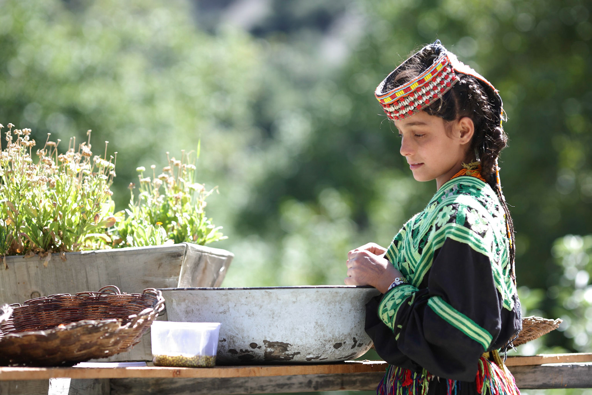 Kalash Lady helped with housework in autumn afternoon. (Travel)