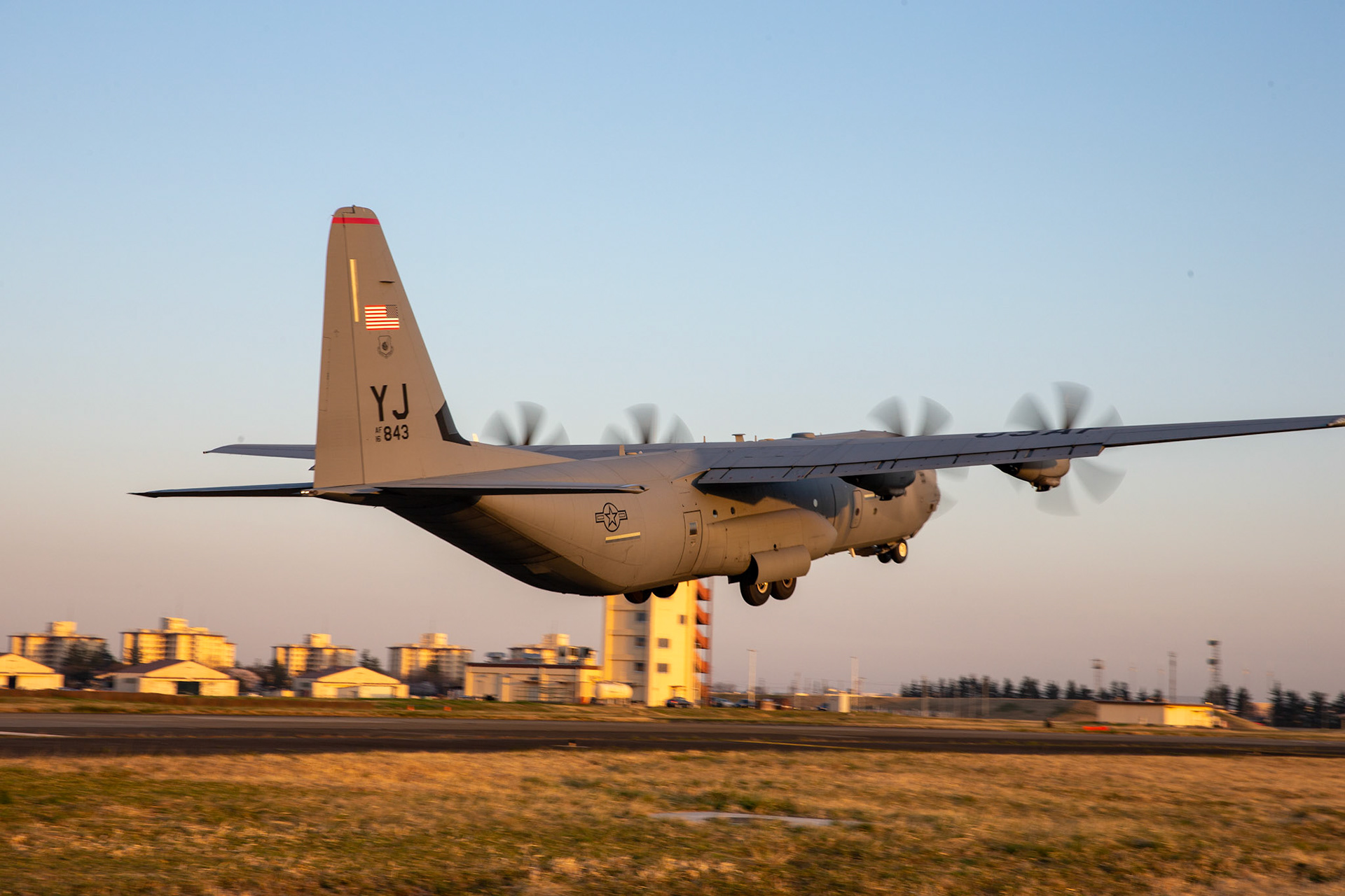 A C-130J Super Hercules assigned to the 36th Airlift Squadron takes off from Foxtrot taxiway at Yokota Air Base, Japan, March 26, 2020. A C-130J used Foxtrot taxiway here as a landing zone for an assault landing for the first time. Training like this ensures the mission can continue at the Yokota airfield despite any potential setbacks that impact operations to the main runway. (U.S. Air Force photo by Yasuo Osakabe)