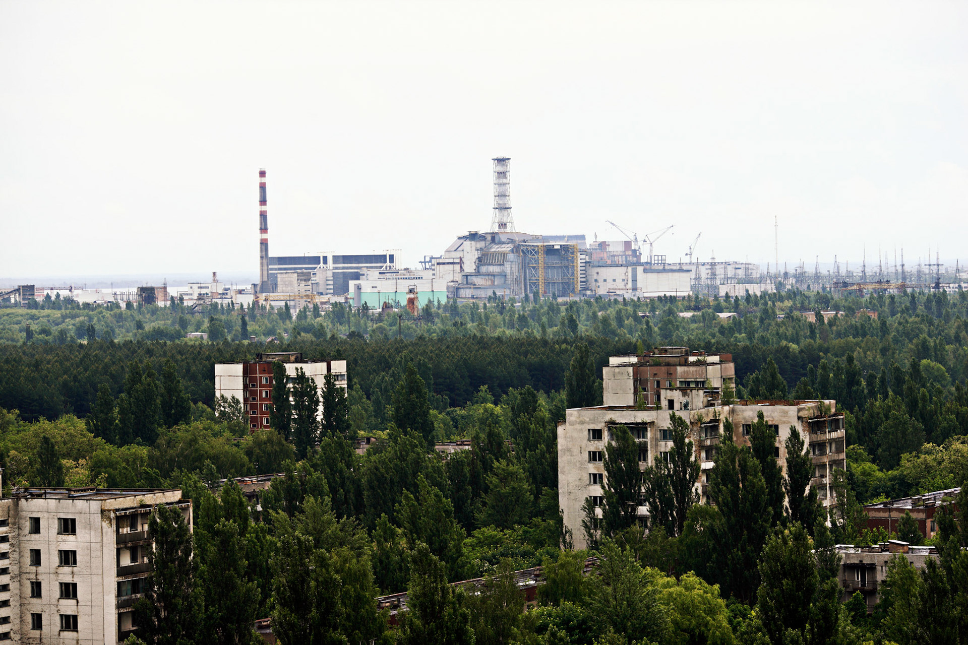 Pripyat is an abandoned city in the zone of alienation in northern Ukraine, Kiev Oblast, near the border with Belarus. The city was founded in 1970 to house the Chernobyl Nuclear Power Plant workers, and was abandoned in 1986 following the Chernobyl disaster. Its population had been around 50,000 prior to the accident. This view is from 16-storeyed building near by the center of Pripyat town.