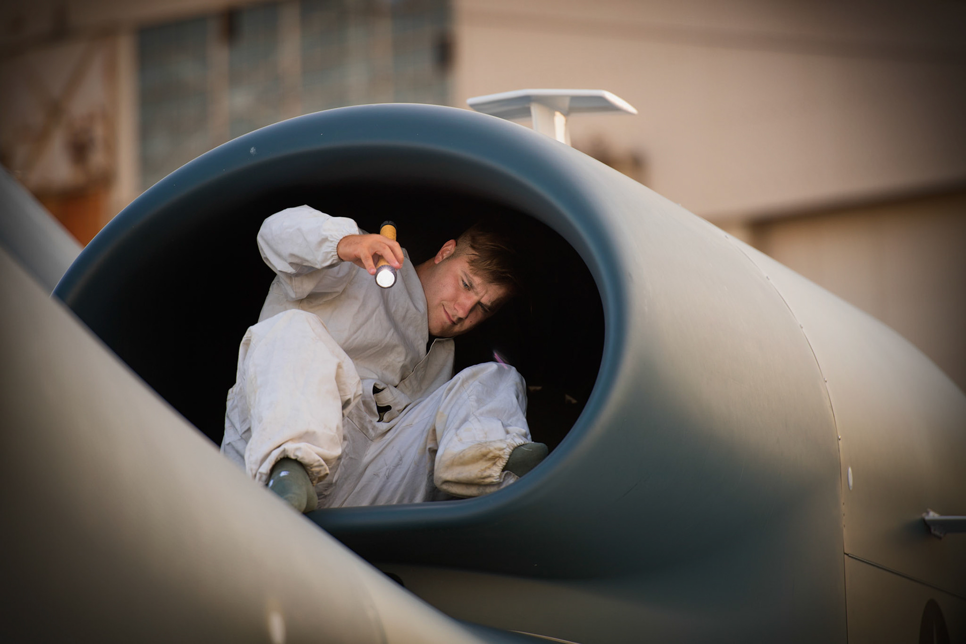 Senior Airman Vincent Lanzo, 69th Reconnaissance Group Detachment 1 avionics technician, completes inspection of  the fan blades on an RQ-4 Global Hawk engine during a pre-flight inspection at Yokota Air Base, Japan.  The Global Hawk supports U.S. intelligence, surveillance, and reconnaissance priorities, operational plans, and contingency operations throughout the Pacific theater. (U.S. Air Force photo by Yasuo Osakabe)