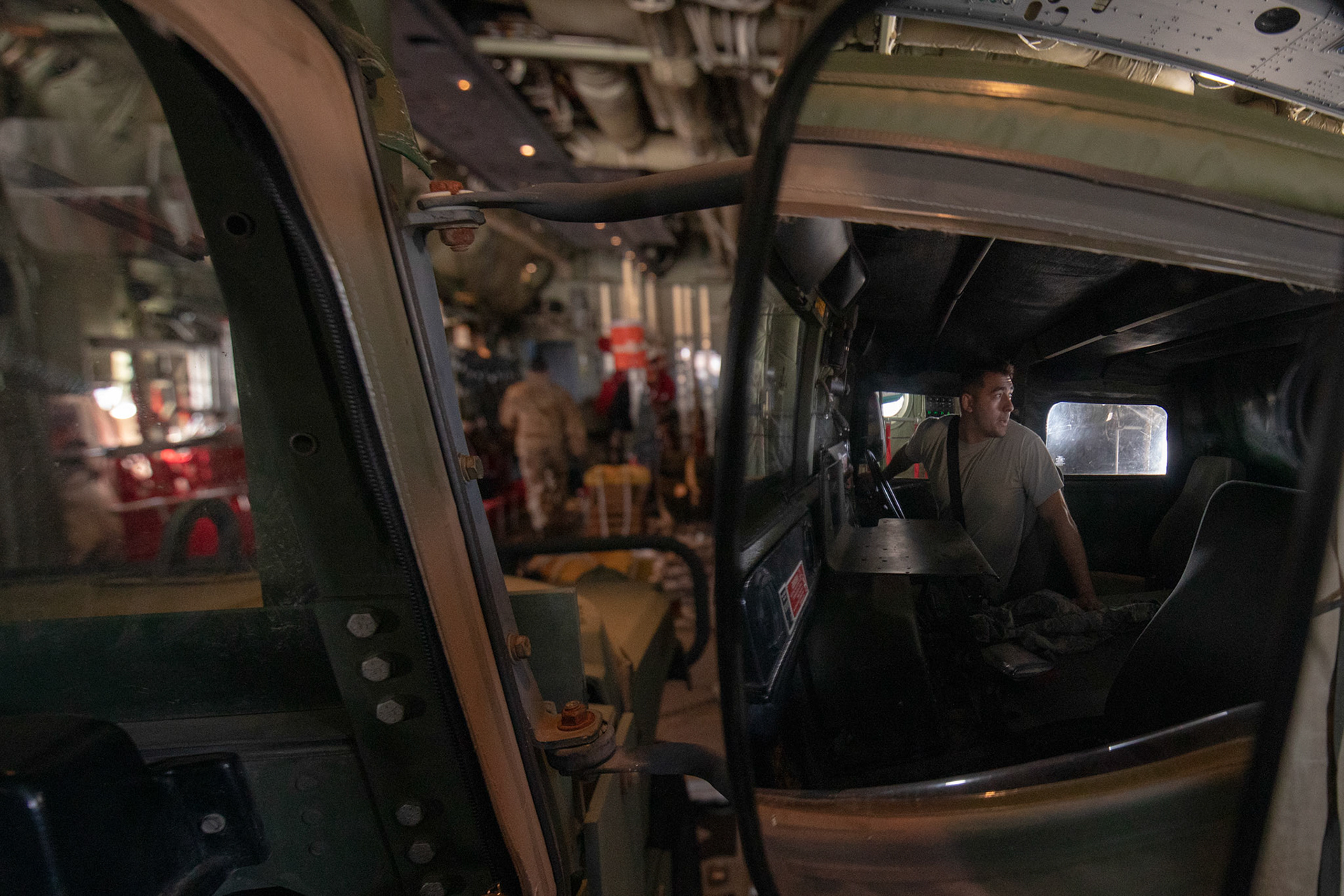 Senior Airman Dominic Pacheco, 374th Logistics Readiness Squadron combat mobility operations technician, performs a visual confirmation during the Yokota C-130J Rodeo at Yokota Air Base, Japan, March 22, 2019. Two of six events that make up the Rodeo competition was a reverse taxi and a Humvee vehicle on and off-load which judged both pilots and loadmasters on their ability to successfully complete the tasks. (U.S. Air Force photo by Yasuo Osakabe)