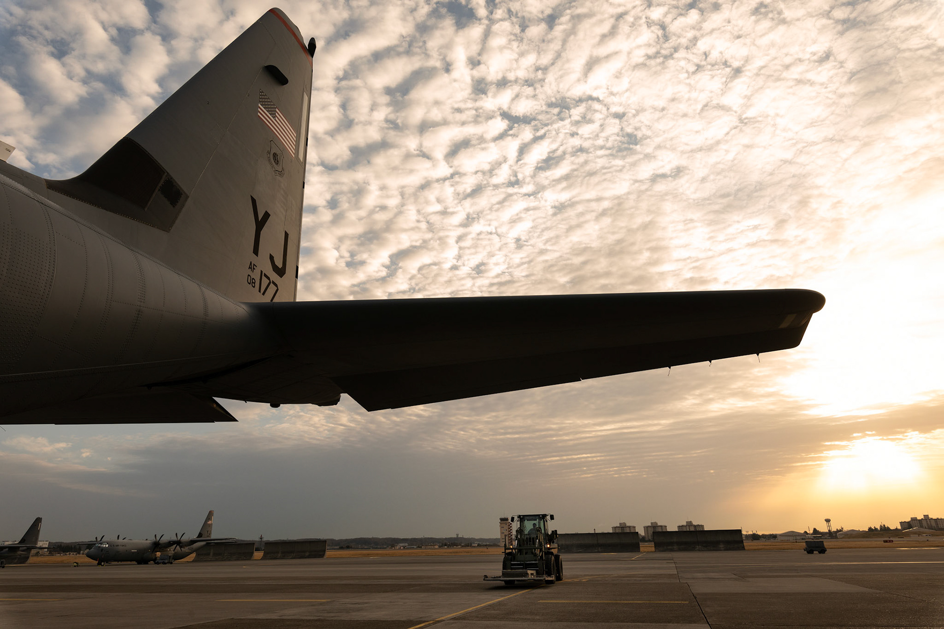An Airman with the 374th Logistics Readiness Squadron combat mobility flight waits to load a pallet for a simulated combat offload during the Yokota C-130J Rodeo at Yokota Air Base, Japan, March 22, 2019. The Rodeo is a tactical airlift competition between flights within the 36th Airlift Squadron and 374th Operations Support Squadron, whose goal is to demonstrate capabilities, improve procedures, and enhance standardization for global operations.  (U.S. Air Force photo by Yasuo Osakabe)