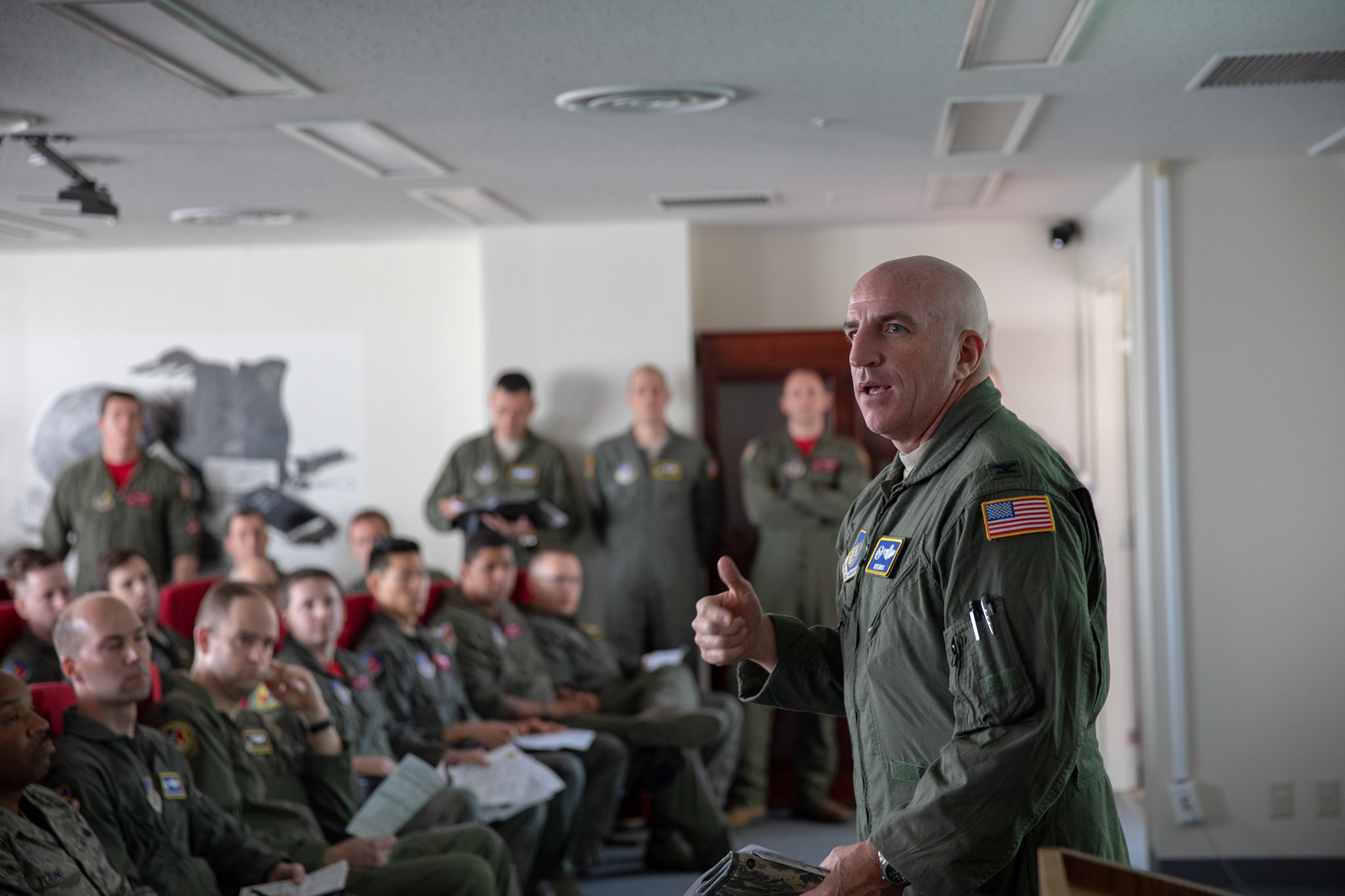 Col. Kenneth Moss, 374th Airlift Wing (AW) commander, talks to crewmembers prior to the 374th AW Generation Exercise Elephant Walk at Yokota Air Base, Japan, May 4, 2018. The 374th AW operates a mission fleet of C-130J Super Hercules, C-12 Hurons and UH-1N Iroquois as the primary Western Pacific airlift hub for U.S. Air Force peacetime and contingency operations. (U.S. Air Force photo by Yasuo Osakabe)