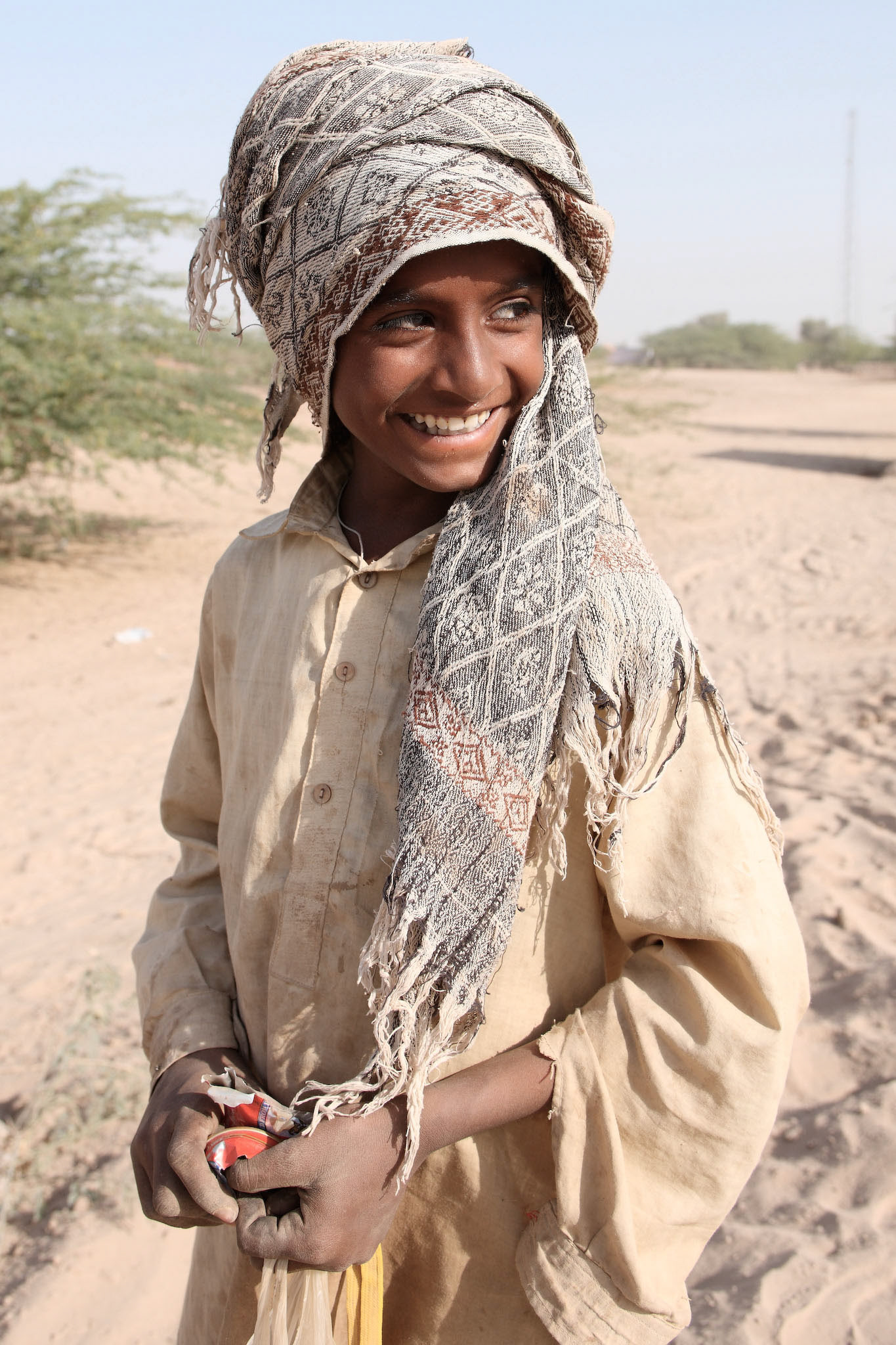 He lives in Cholistan desert as a camel handler. He takes care of his camels and makes a beautiful Cholistan style geometric designs on his camels. (Travel)