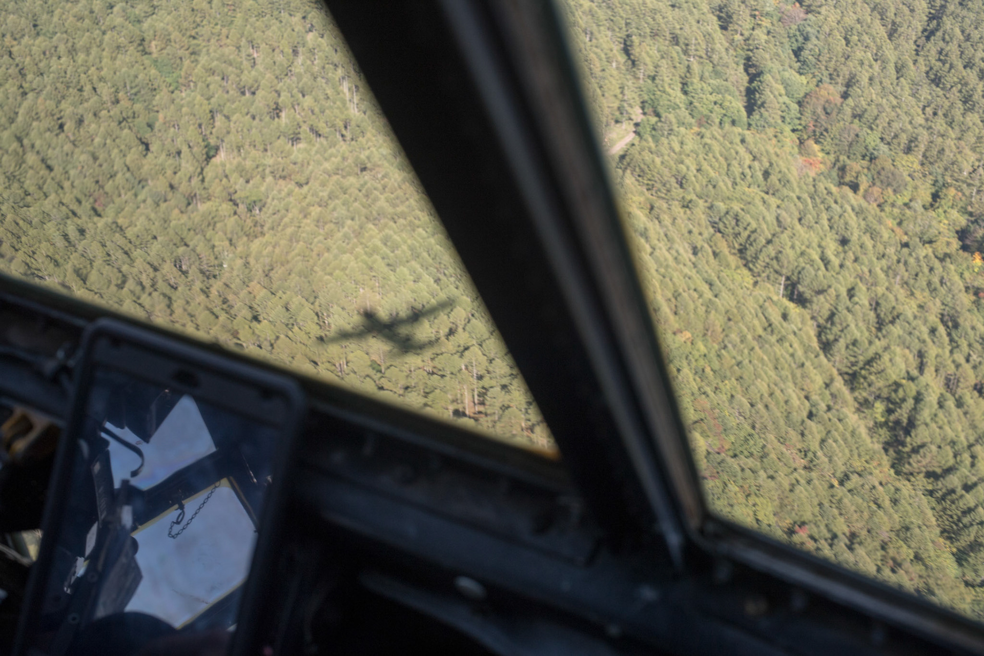 A C-130H Hercules assigned to the 36th Airlift Squadron flies over a forest during a tactical training sortie, over Yamanashi Prefecture, Japan, Oct. 5, 2017. This is the last active duty C-130H Hercules tactical training sortie. (U.S. Air Force photo by Yasuo Osakabe)