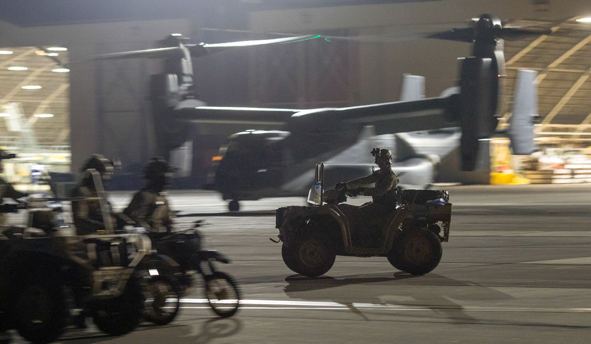 An Air Force Special Tactics operator assigned to the 320th Special Tactics Squadron out of Kadena Air Base, Japan, drives a tactical vehicle on the flightline, during Exercise Gryphon Jet at Yokota Air Base, Japan, June 23, 2020. Special Tactics is a U.S. Special Operation Command's tactical air and ground integration force, and the Air Force's special operations ground force, leading Global Access, Precision Strike, Personnel Recovery and Battlefield Surgery operations on the battlefield. Exercise Gryphon Jet is an integrated training exercise focused on improving interoperability throughout the special operations community. (U.S. Air Force photo by Yasuo Osakabe)