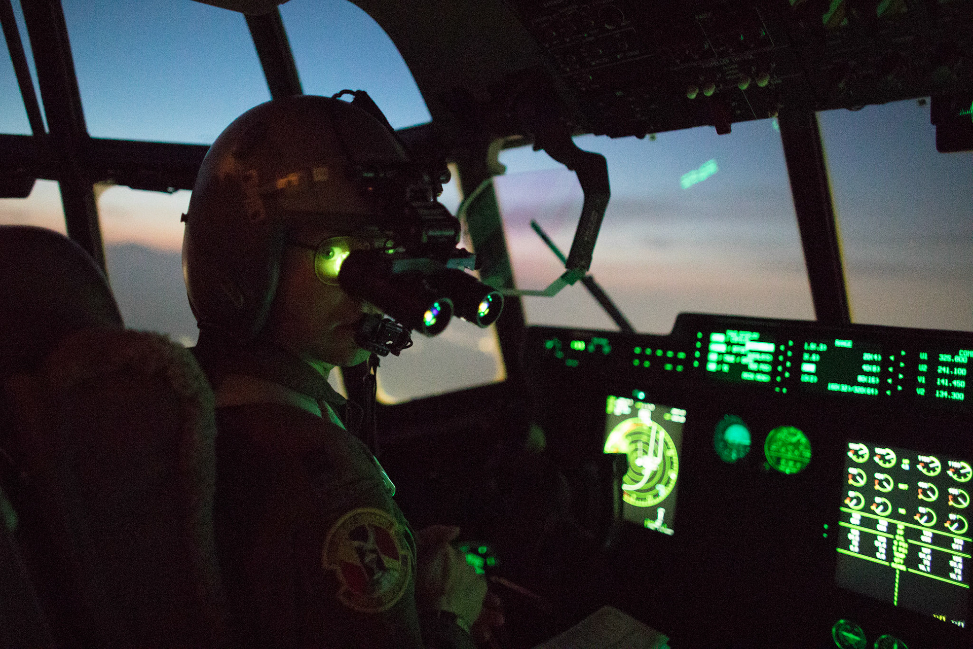 Capt. Andrew Huddleston, 36th Airlift Squadron C-130J pilot, wears night vision goggle during a training mission above Yokota Air Base, Japan, March 26, 2018. Yokota aircrews regularly conduct night flying operations to ensure they are prepared for a variety of contingencies throughout the Indo-Asia Pacific region. (U.S. Air Force photo by Yasuo Osakabe)