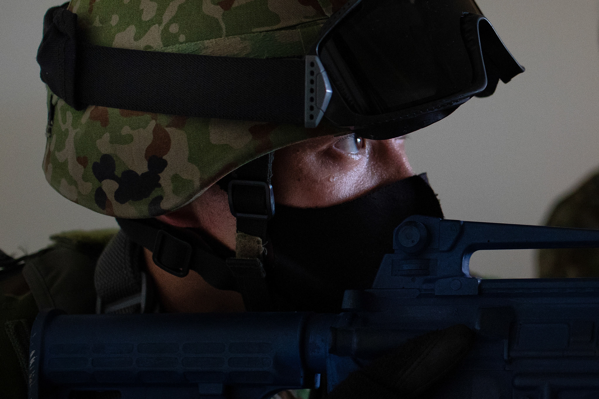 A Japan Ground Self-Defense Force soldier assigned to the 34th Infantry Regiment, 1st Division, conduct a room clearing during  close-quarters combat bilateral training at Yokota Air Base, Japan, July 2, 2021. The 374th SFS trainers welcomed members of the JGSDF to embed into multiple training situations to help strengthen combined operation between U.S. and Japan forces. (U.S. Air Force photo by Yasuo Osakabe)