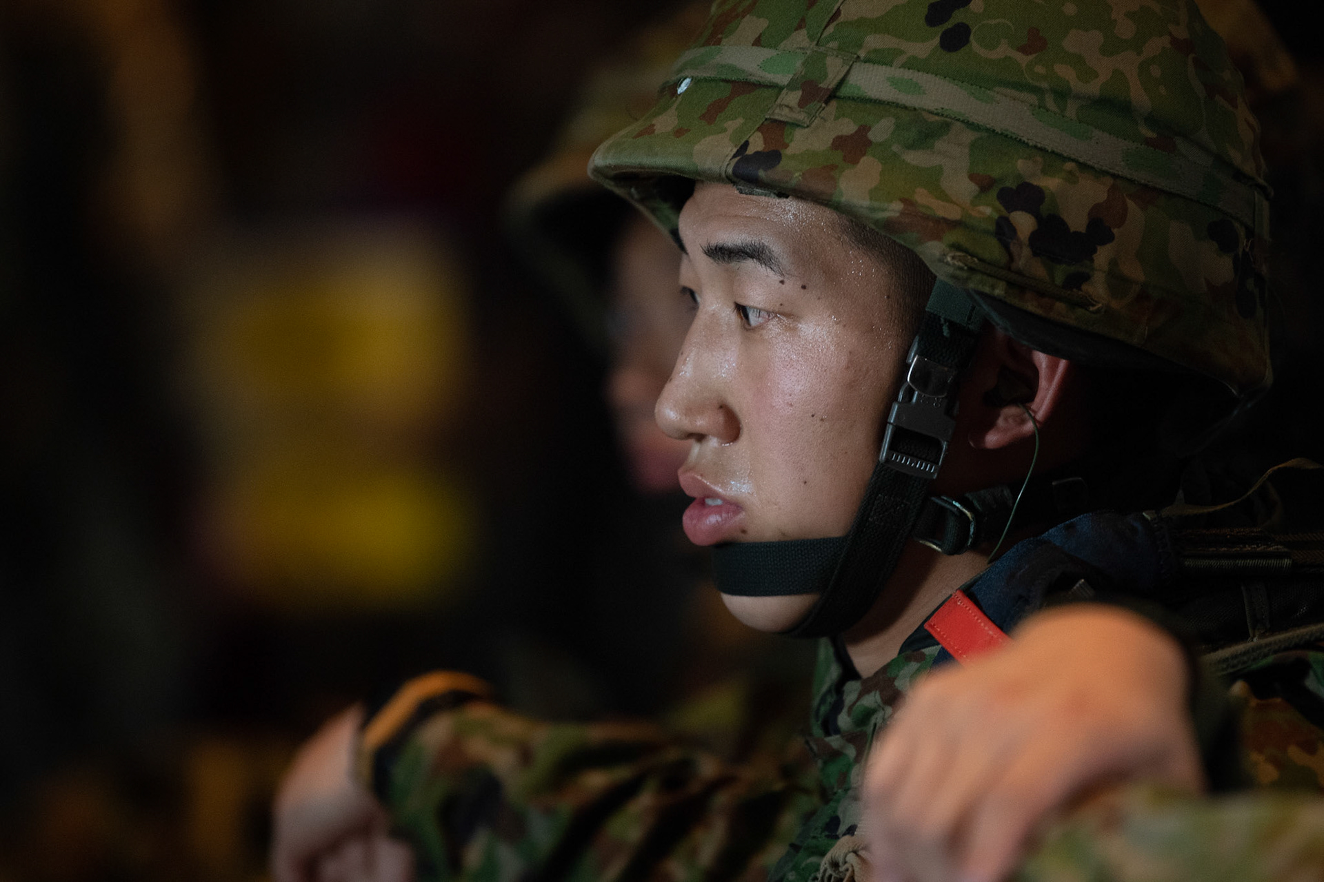 A Japan Ground Self-Defense Force soldier assigned to the 1st Airborne Brigade boards a U.S. Air Force C-130J Super Hercules assigned to the 36th Airlift Squadron at Japan Air Self-Defense Force Tsuiki Air Base, Japan, July 16, 2019, during a bilateral jump training. The training allows USAF and JGSDF units to work alongside each other while improving the readiness of our armed forces. (U.S. Air Force photo by Yasuo Osakabe)