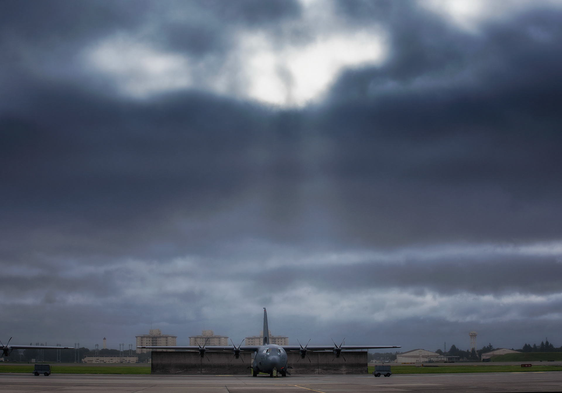 A C-130J Super Hercules assigned to the 36th Airlift Squadron sits on the flightline at Yokota Air Base, Japan, Aug. 8, 2018, during Tropical Cyclone Conditions of Readiness (TCCOR) 3. Typhoon Shanshan approached near the Kanto Plain and made its move quickly Northeast away from the Kanto Plain on Aug. 9. (U.S. Air Force photo by Yasuo Osakabe)